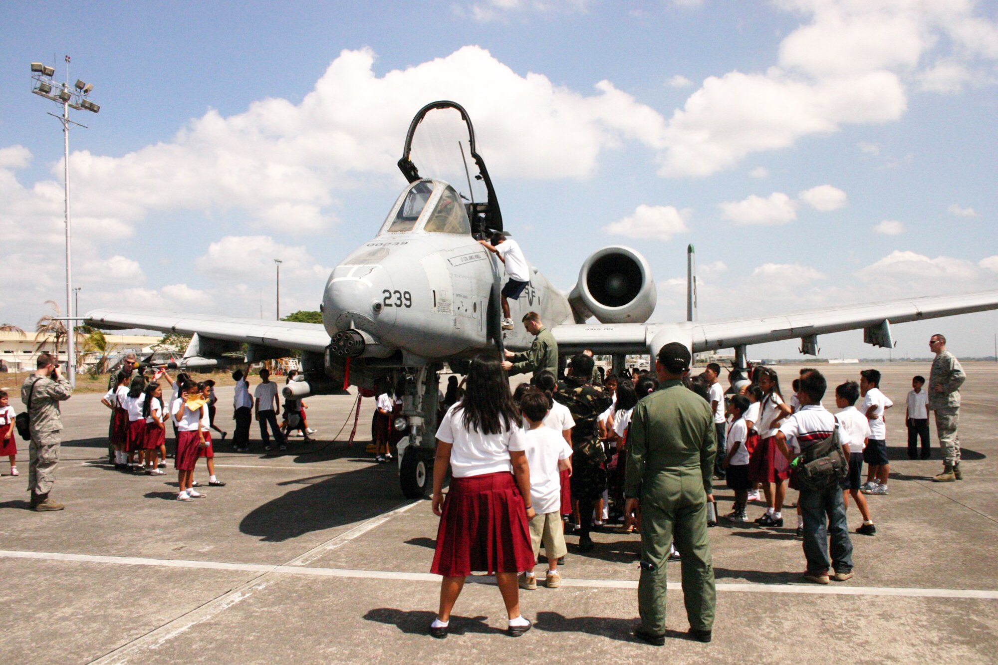 Philippine students view an A-10 Thunderbolt II on the flightline during Balikatan 2010 March 15, 2010, at Freeport Clark, Philippines. (U.S. Marine Corps photo/Gunnery Sgt. Cindy Fisher)
