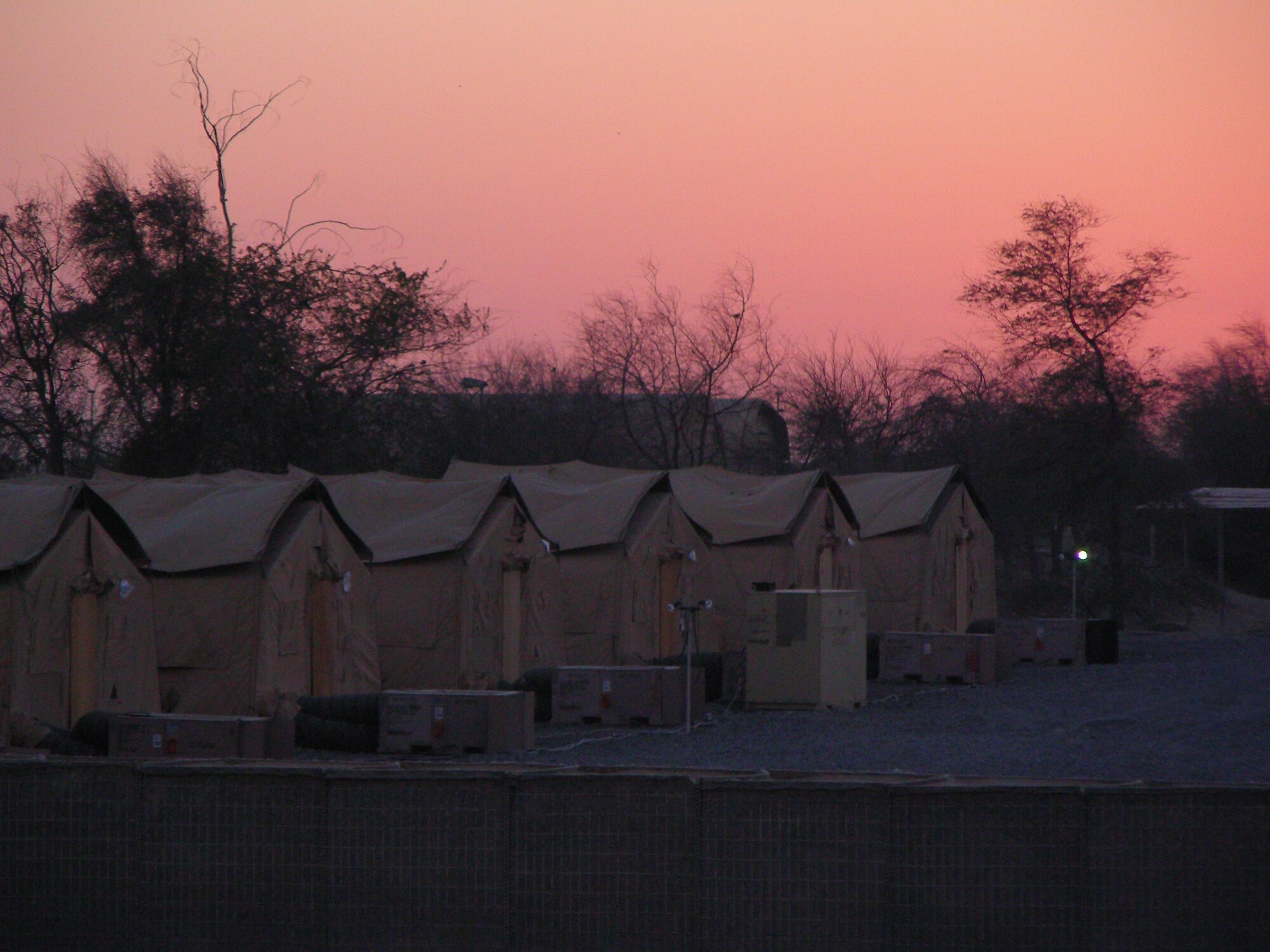 Although this row of tents at an undisclosed location in Southwest Asia is far away from Anywhere, U.S.A., it's home to a civil engineering unit which will be working on a building project for the 380th Air Expeditionary Wing. The temperature rose to 100 degrees March 18, two days before the first day of Spring. (U.S. Air Force Photo/Capt. Cathleen Snow/Released)