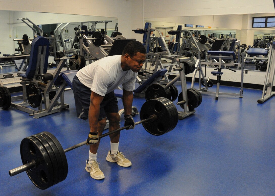 Staff Sgt. Michael Dove, 316th Civil Engineer Squadron explosive ordnance disposal technician, more than 400 pounds during a “dead lift” exercise in the weight room at the West Fitness Center on Joint Base Andrews, Md., March 18, 2010. Members of the 316 CES EOD team conduct physical training at least once every weekday to maintain their fitness. 316 EOD members not only maintain their physical fitness, but their readiness to be prepared for any range of physical challenges their career may present, such as lifting equipment or working in a bomb suit. (U.S. Air Force photo by Chelsea Gitzen)
