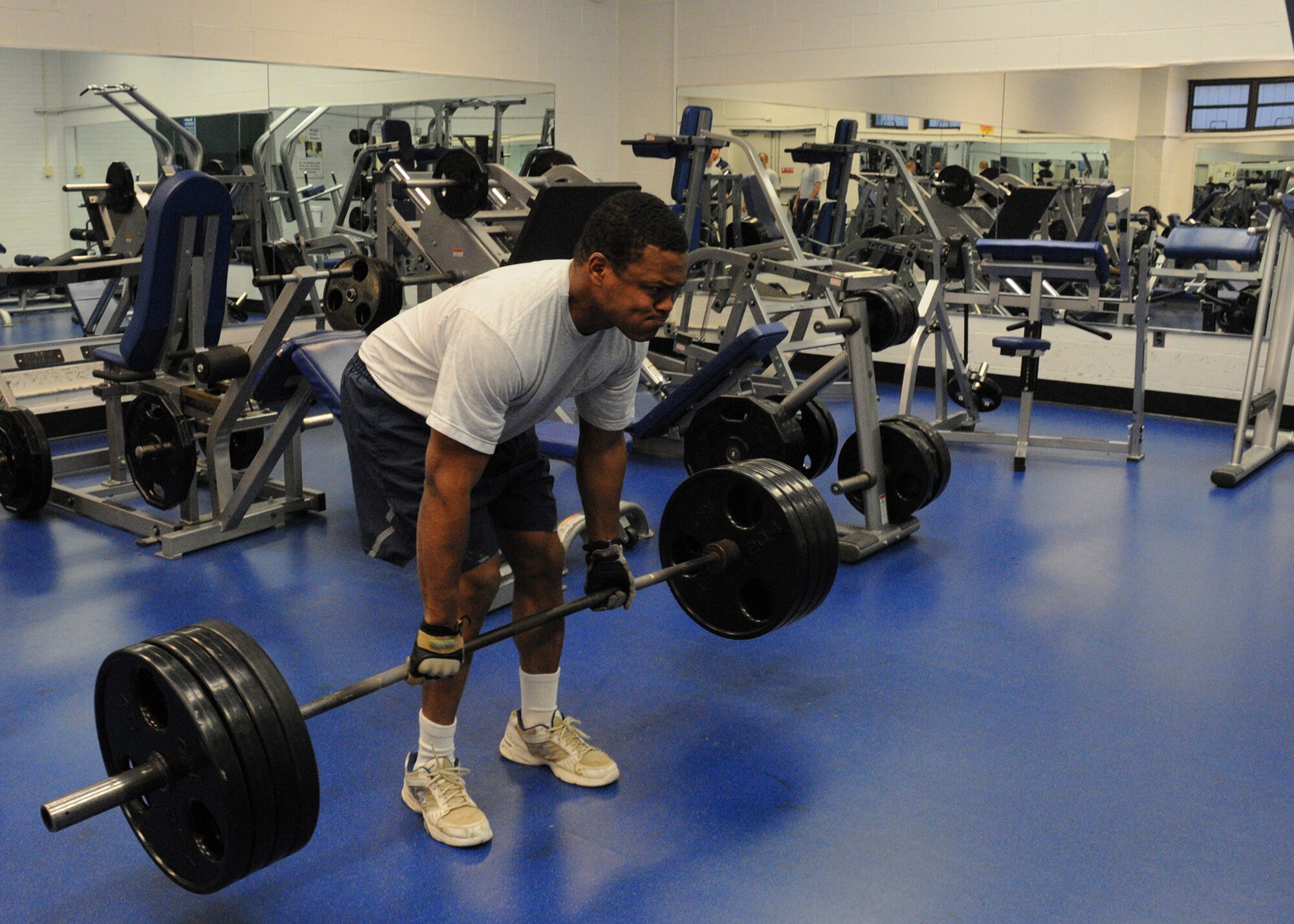 Staff Sgt. Michael Dove, 316th Civil Engineer Squadron explosive ordnance disposal technician, more than 400 pounds during a “dead lift” exercise in the weight room at the West Fitness Center on Joint Base Andrews, Md., March 18, 2010. Members of the 316 CES EOD team conduct physical training at least once every weekday to maintain their fitness. 316 EOD members not only maintain their physical fitness, but their readiness to be prepared for any range of physical challenges their career may present, such as lifting equipment or working in a bomb suit. (U.S. Air Force photo by Chelsea Gitzen)