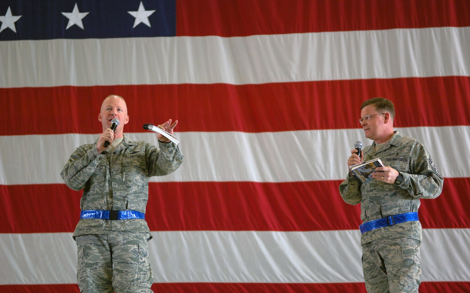 SCOTT AIR FORCE BASE, Ill. – Col. Gary Goldstone, 375th Air Mobility Wing commander, speaks to several hundred encouraging them to be “outstanding” during the upcoming Operational Readiness Inspection while Chief Master Sgt. James Suttles, 375th AMW command chief, looks on, March 19, 2010. (U.S. Air Force photo/ Senior Airman Ryan Crane)
