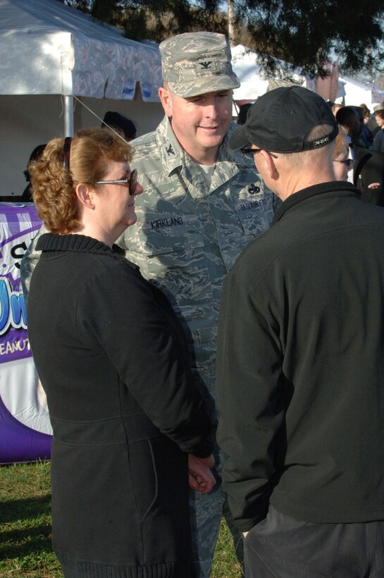 LANGLEY AIR FORCE BASE, Va. – Col. Donald Kirkland, 633d Air Base Wing commander, and his wife, Judy, talk with Richard K. Smucker, J. M. Smucker Company executive chairman and co-CEO, at the Smucker's Mission: Breakfast celebration March 19. Smucker's provided free breakfast to military personnel and their families to reward the Langley Commissary for winning the Mission: Breakfast contest for most unique store display. (U.S. Air Force photo/Airman 1st Class Jason J. Brown)