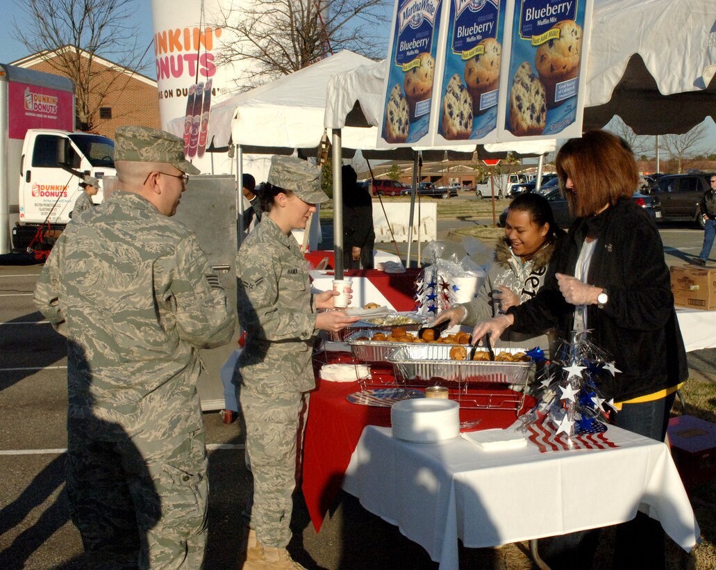 LANGLEY AIR FORCE BASE, Va. – Airmen enjoy free coffee and muffins at the Smucker's Mission: Breakfast celebration March 19. Smucker's provided free breakfast to military personnel and their families to reward the Langley Commissary for winning the Mission: Breakfast contest for most unique store display. (U.S. Air Force photo/Airman 1st Class Jason J. Brown)