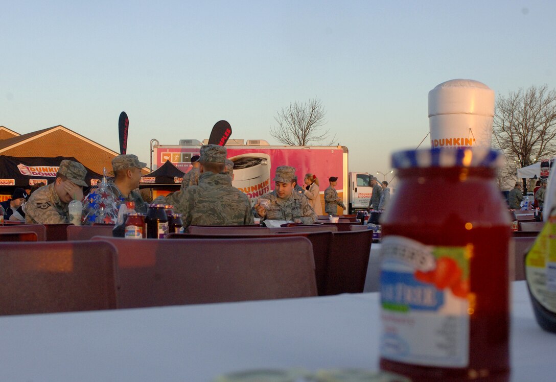 LANGLEY AIR FORCE BASE, Va. – Airmen share laughs over breakfast at the Smucker's Mission: Breakfast celebration March 19. Smucker's provided free breakfast to military personnel and their families to reward the Langley Commissary for winning the Mission: Breakfast contest for most unique store display. (U.S. Air Force photo/Airman 1st Class Jason J. Brown)
