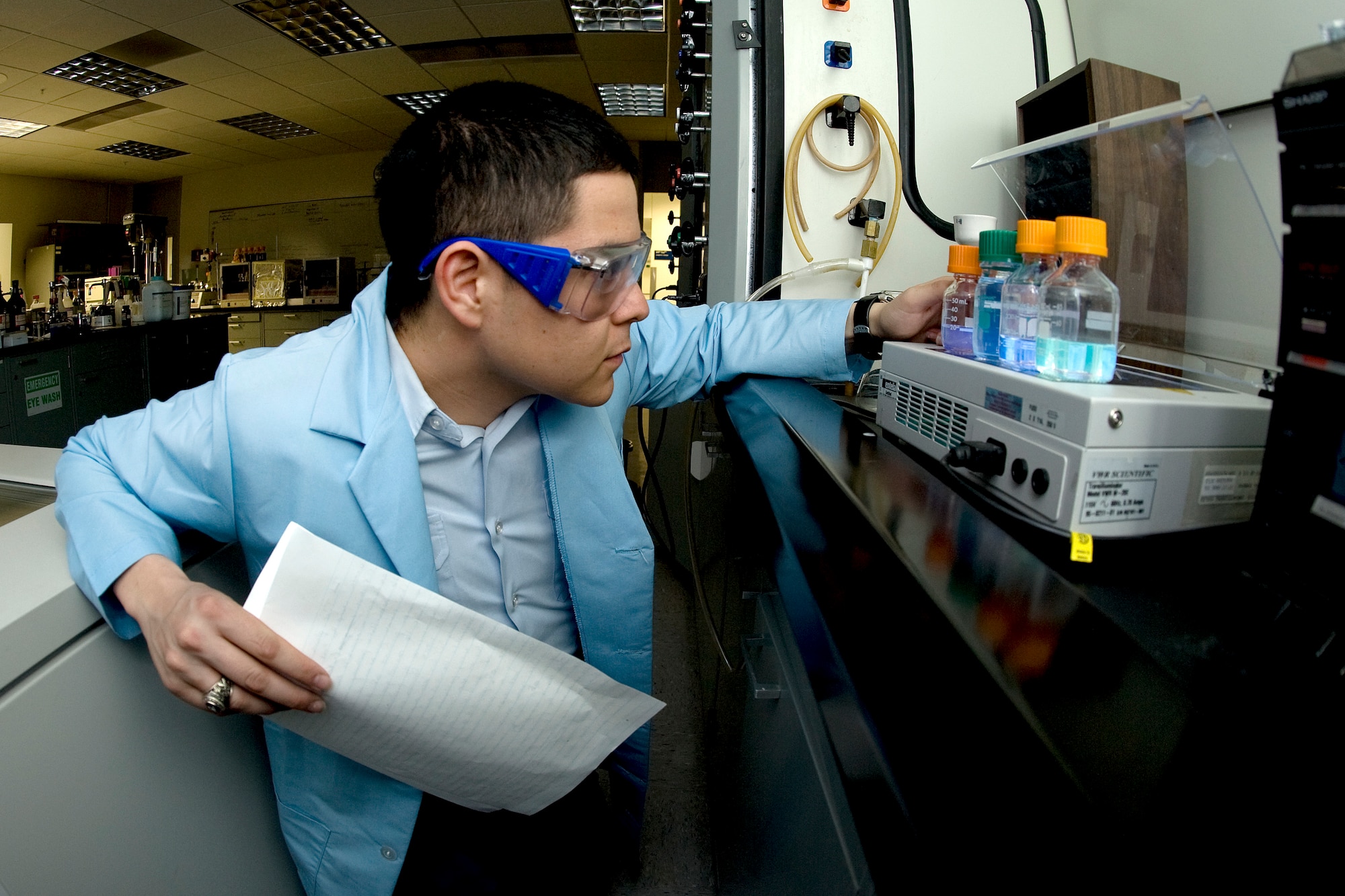 Air Force Academy Cadet 1st Class Chris Horn examines ionic liquids in a chemistry laboratory at the Academy March 15, 2010. The Academy is developing a fast, environmentally friendly method to neutralize chemical warfare agents such as sarin and VX using certain ionic liquids. Cadet Horn and Cadet 1st Class Joe Lewczyk are also conducting follow-on research with ionic liquids to determine whether the room-temperature molten salts can neutralize certain biological agents. (U.S. Air Force photo/Johnny Wilson)