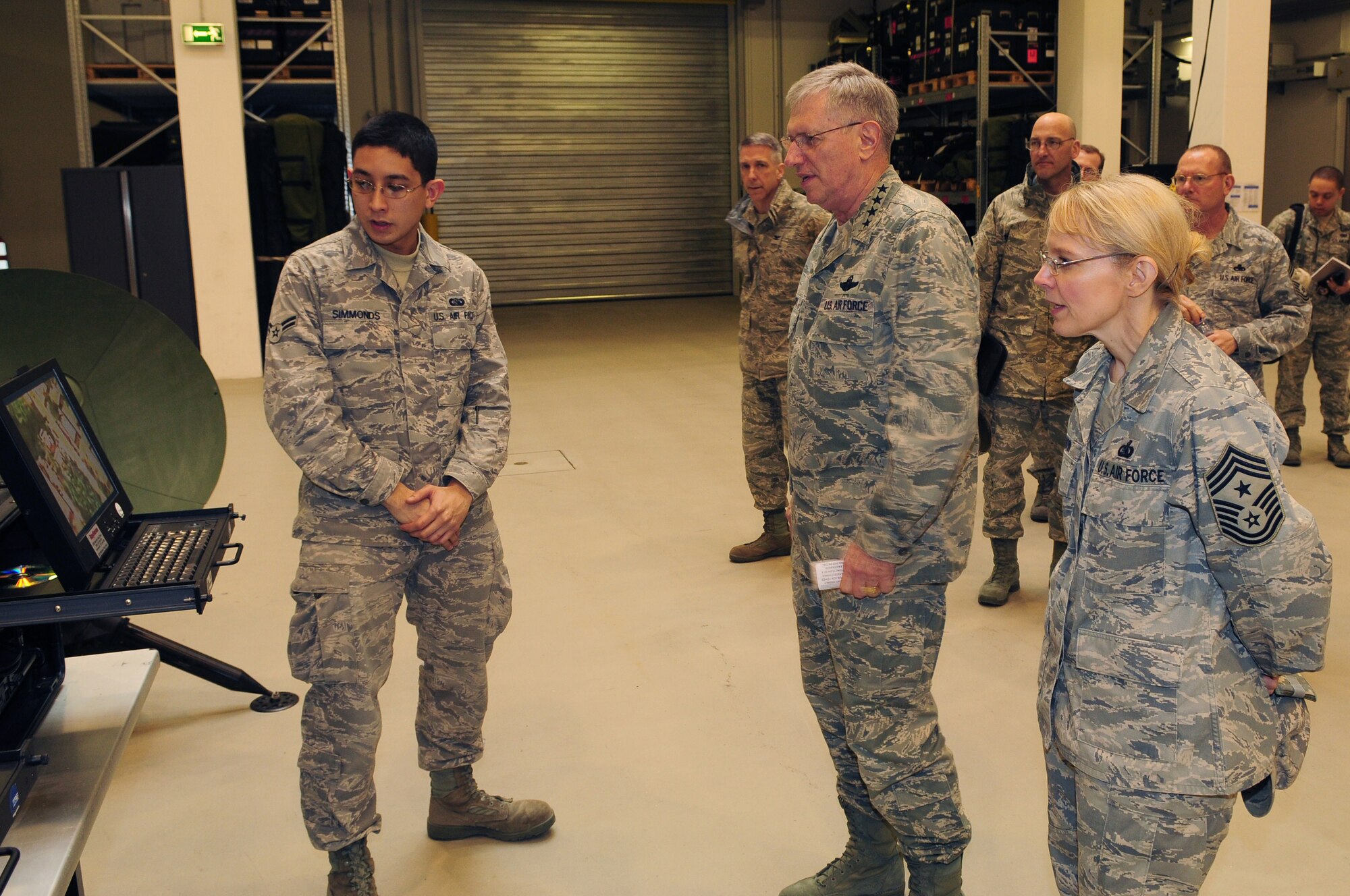 RAMSTEIN AIR BASE, Germany -- Gen. Roger A. Brady, commander U.S. Air Forces in Europe, and Chief Master Sgt. Pamela Derrow, USAFE command chief master sergeant, receive a briefing about the Global Broadcast Service Communications suite from Airman 1st Class Saunder Simmonds, 1st Combat Communications Squadron, March 16, 2010. General Brady and Chief Derrow spent the day visiting the facilities of the 435th Air Ground Operations Wing, their first visit to USAFE's newest wing since it stood up in July 2009. (U.S. Air Force photo by Airman Desiree Esposito)