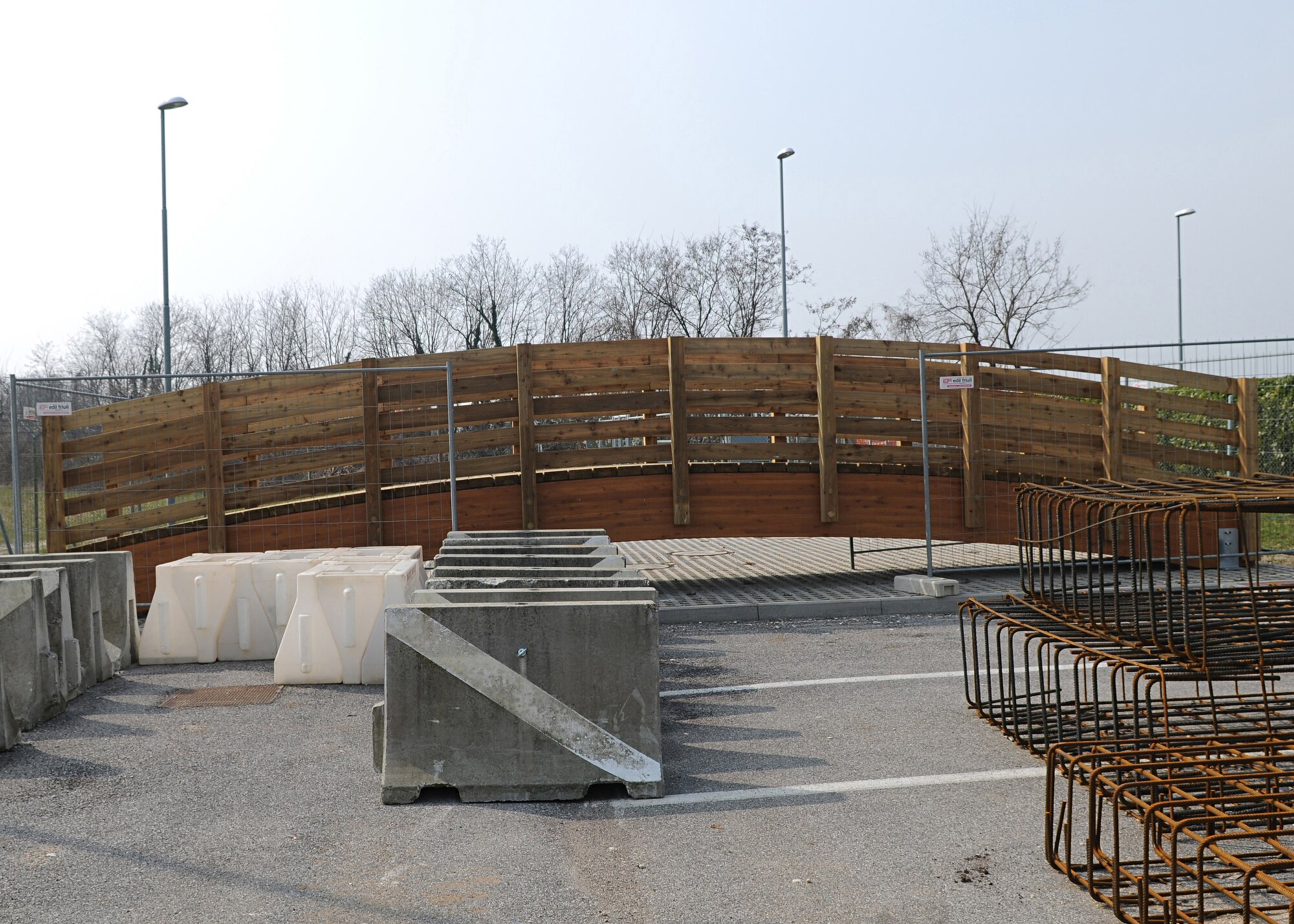 A pedestrian bridge will be installed to connect the upper perimeter parking lot with the main Shoppette parking area. The new bridge will provide an access to 70 parking spots on the upper perimeter, which will cut the distance to the Shoppette side by half and to the school facilities in the area by a third.  This bridge is scheduled to open in May. (Air Force photo/Staff Sgt. Taylor Marr)