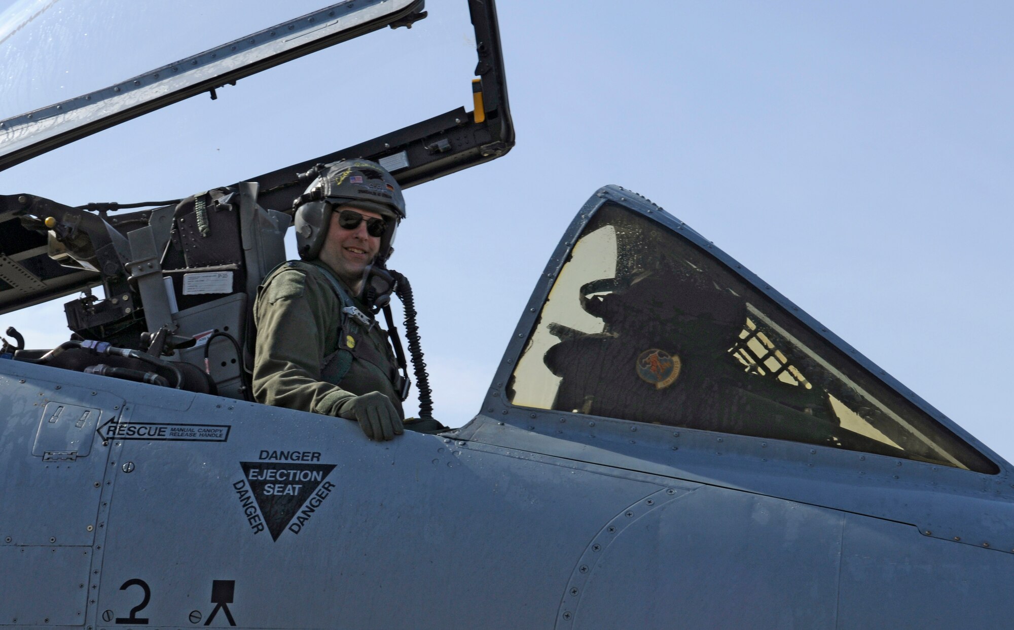 SPANGDAHLEM AIR BASE, Germany – Lt. Col. Joseph Less, 52nd Operations Group deputy commander, smiles at the controls of an A-10 Thunderbolt II on the flightline after his final flight as a member of the U.S. Air Force March 18. Colonel Less has flown more than 3,800 hours with the Air Force since becoming a pilot in 1988. (U.S. Air Force photo/Senior Airman Benjamin Wilson)