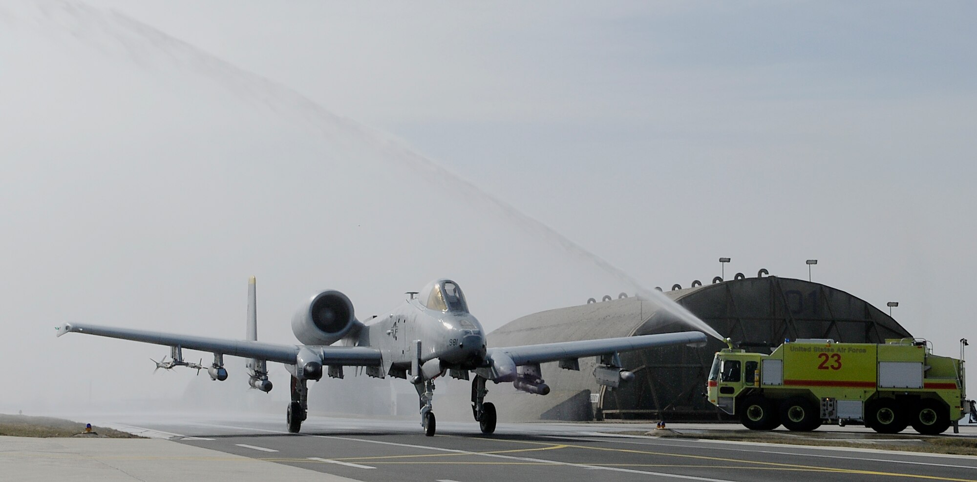 SPANGDAHELM AIR BASE, Germany – Lt. Col. Joseph Less, 52nd Operations Group deputy commander, taxies an A-10 Thunderbolt II through an arch of water on the flightline after his final flight as a member of the U.S. Air Force March 18. Colonel Less has flown more than 3,800 hours with the Air Force since becoming a pilot in 1988. (U.S. Air Force photo/Senior Airman Benjamin Wilson)