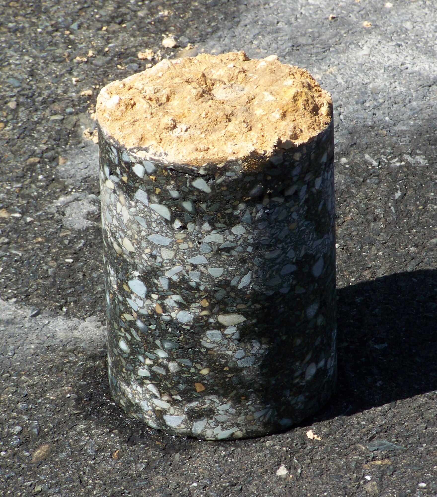 A sample that was drilled from a Haitian runway that will be further inspected and reported on to help increase the cpacity of the country's airfields. (U.S. Air Force courtesy photo)