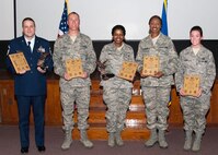 Among the 919th Special Operations Wing's top perfomers shown with their awards are, from left: Senior Master Sgt. Christopher Fordham (Senior NCO quarterly and annual award), Tech. Sgts. Paul Robert (NCO quarterly award), LaTisha Davies (NCO quarterly and annual award) and Glenda Stewart (NCO quarterly award) and Senior Airman Kristina Dean (Airman quarterly award).  (Courtesy photo)
