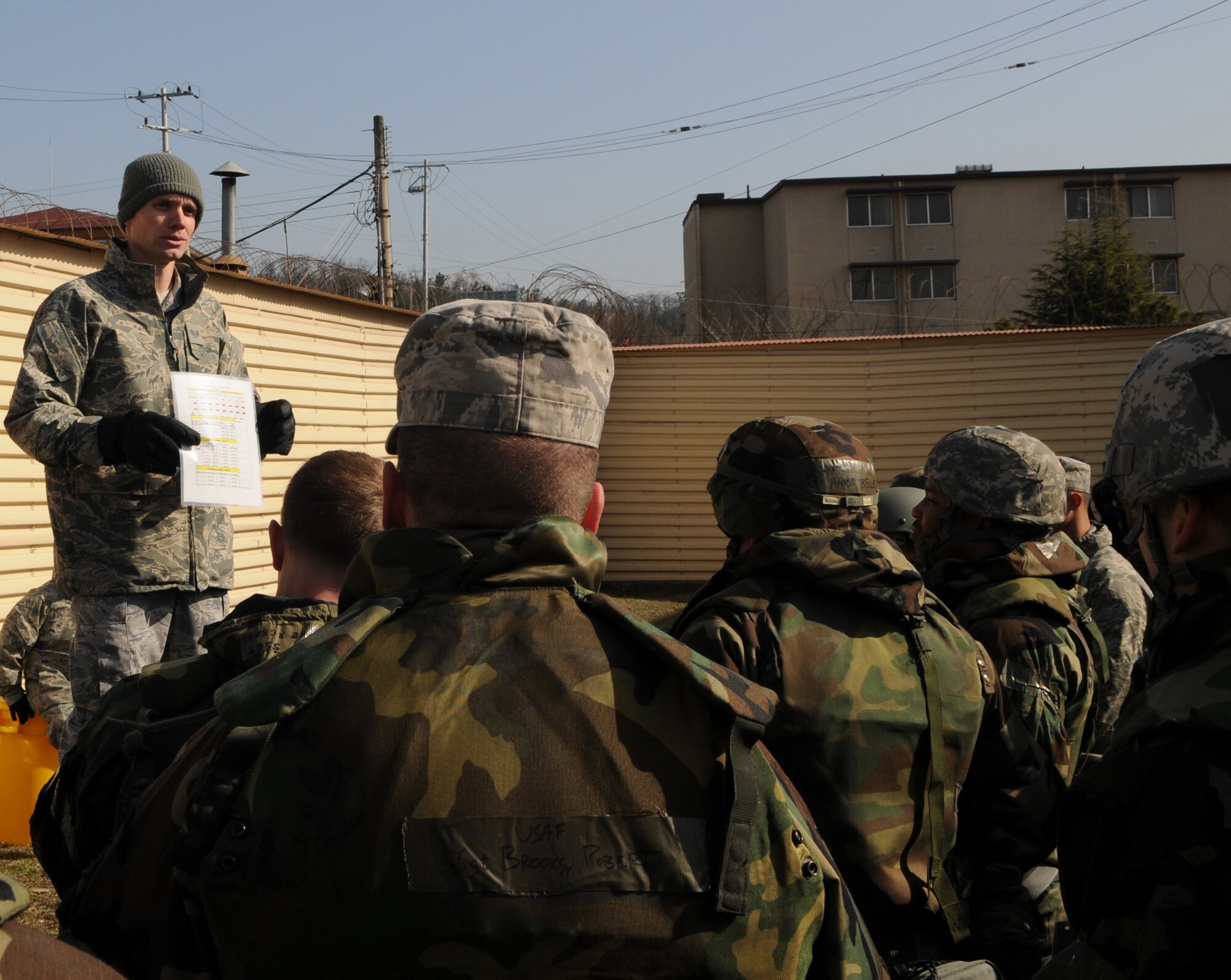 DAEGU AIR BASE, Republic of Korea -- Staff Sgt. Daniel Van Stone, the 353rd Operations Support Squadron emergency management specialist, instructs members of the 353rd Special Operations Group on how to properly conduct searches around buildings after an attack during training here March 19. The training is in preparation for the group's annual operational readiness exercise which affords unit members an opportunity to practice wartime skills necessary for their ability to survive and operate. (U.S. Air Force photo by Tech. Sgt. Aaron Cram)