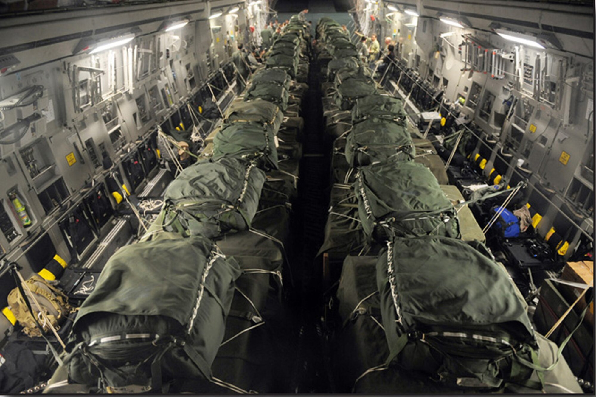 A C-17 Globemaster III from Charleston Air Force Base, S.C., is loaded with 40 container delivery system bundles totaling 67,800 pounds of meals, ready-to-eat and bottled water before an air delivery mission in support of Operation Unified Response. (Staff Sgt. Jacob N. Bailey)