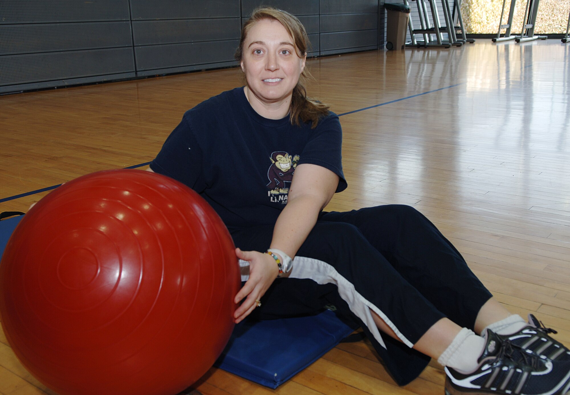Jia Elliott, Air Force spouse and mother of two, participates in hardcore classes at the Southside Fitness Center on Ramstein Air Base, Germany, as part of the fourth-annual Biggest Loser Competition. Mrs. Elliot says her biggest driving force each week is being held accountable for her weight and measurements. (U.S. Air Force photo by Senior Airman Amanda Dick)