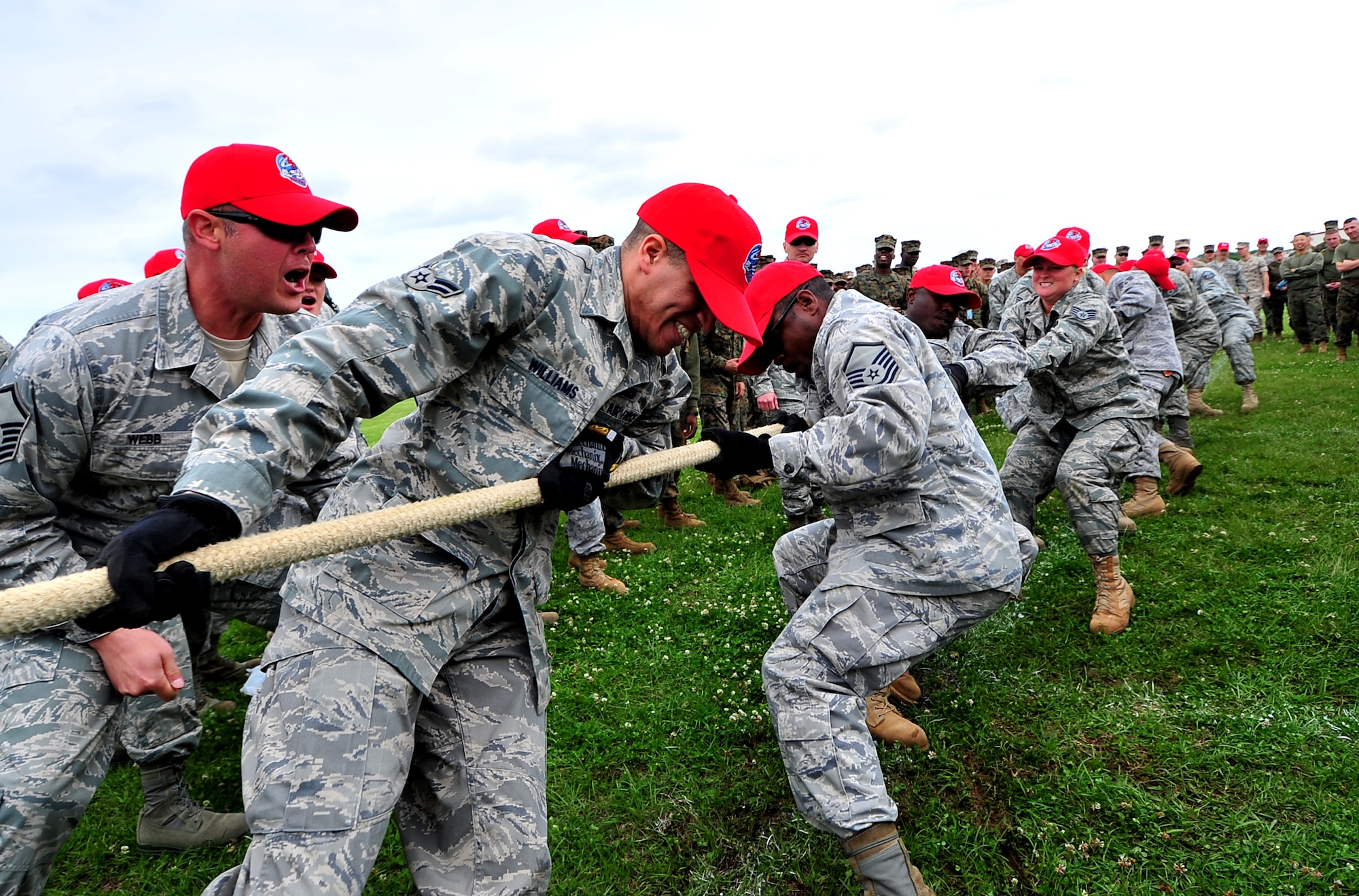 Members of the 554th Red Horse Squadron Detachment 1 compete against a Marine Corps engineering unit in tug-of-war. 