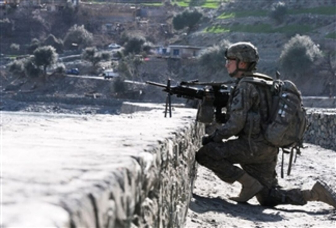 U.S. Army Spc. Alex Folmar, a gunner with 2nd Platoon, Bear Troop, 3rd Squadron, 61st Cavalry Regiment, Task Force Destroyer, provides security during a patrol along the Kunar River in the Naray district of Kunar province, Afghanistan, on March 7, 2010.  The International Security Assistance Force unit was evaluating various civil projects in the area.  