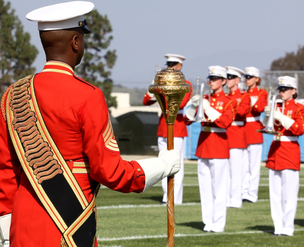 Master Sgt. Kevin Buckles, drum major with “The Commandant’s Own” U.S. Marine Drum and Bugle Corps, 8th and I, Marine Barracks Washington, directs 90 Marine musicians during the annual Battle Color ceremony at Camp Pendleton, March 19. The event also featured a performance by the Silent Drill Platoon and an appearance by the official Marine Corps Color Guard.