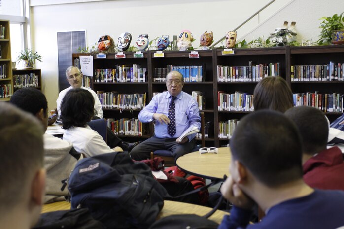 Masayuki Matsumuro, former Kamikaze pilot and World War II survivor, speaks with students in the library at Matthew C. Perry High School here March 19. Despite a tragic past, Matsumuro spoke about the hope of an optimistic future and alliance between Japanese and American forces.