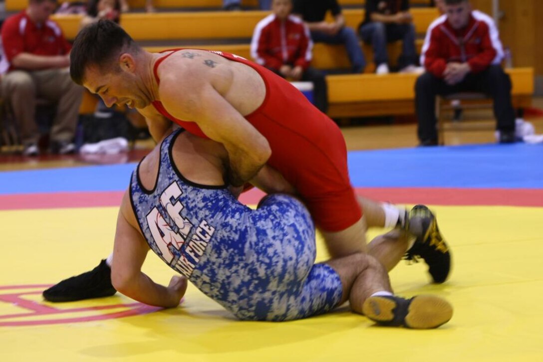 All Marine Wrestling Team member, Marine Sgt. Donavan DePatto, 2008 Armed Forces Wrestling  60kg champion, puts a move on an Air Force opponent during the 2010 Armed Forces Wrestling Championships at the Goettge Memorial Field House, March 20.