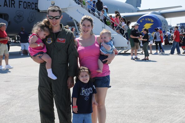 Staff Sgt. Mark Fioritto, a boom operator for the 6th Air Mobility Wing at MacDill Air Force Base, Fla., stands in front of a KC-135 Stratotanker with his wife, Theresa, and their children Melissa, Ashley and Trip at Airfest March 20, 2010. Sergeant Fioritto was part of the static coordination team, which worked behind the scenes to organize the static aircraft displays and accommodate visiting crewmembers for the air show. (U.S. Air Force photo/Tech. Sgt. Denise Hauser)