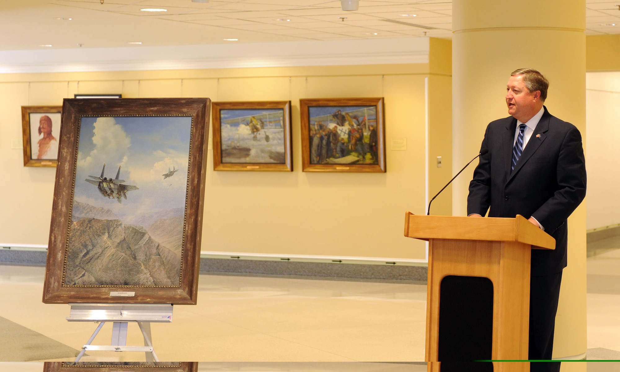 Secretary of the Air Force Michael Donley speaks at the opening of the Air Force Art Gallery in the Pentagon March 18, 2010.  The gallery is located at the fifth-floor apex of corridors 9 and 10 in the Pentagon. The opening featured paintings by the first aviation artist, France's Henri Farre, and the latest addition, "Moving Mountains" by William Phillips, depicting two F-15 Eagles on a combat mission over Afghanistan. (U.S. Air Force photo/Andy Morataya)