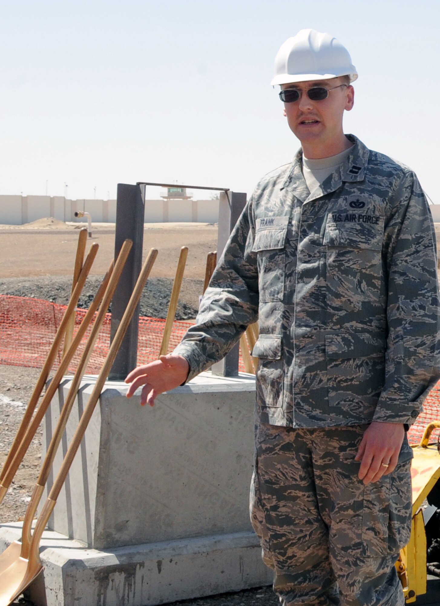 Capt. Timothy Frank, from the 380th Expeditionary Civil Engineer Squadron, gives opening remarks during the groundbreaking ceremony for the construction of a new fuel pipeline at a non-disclosed base in Southwest Asia on March 17, 2010. (U.S. Air Force Photo/Senior Airman Jenifer Calhoun/Released)