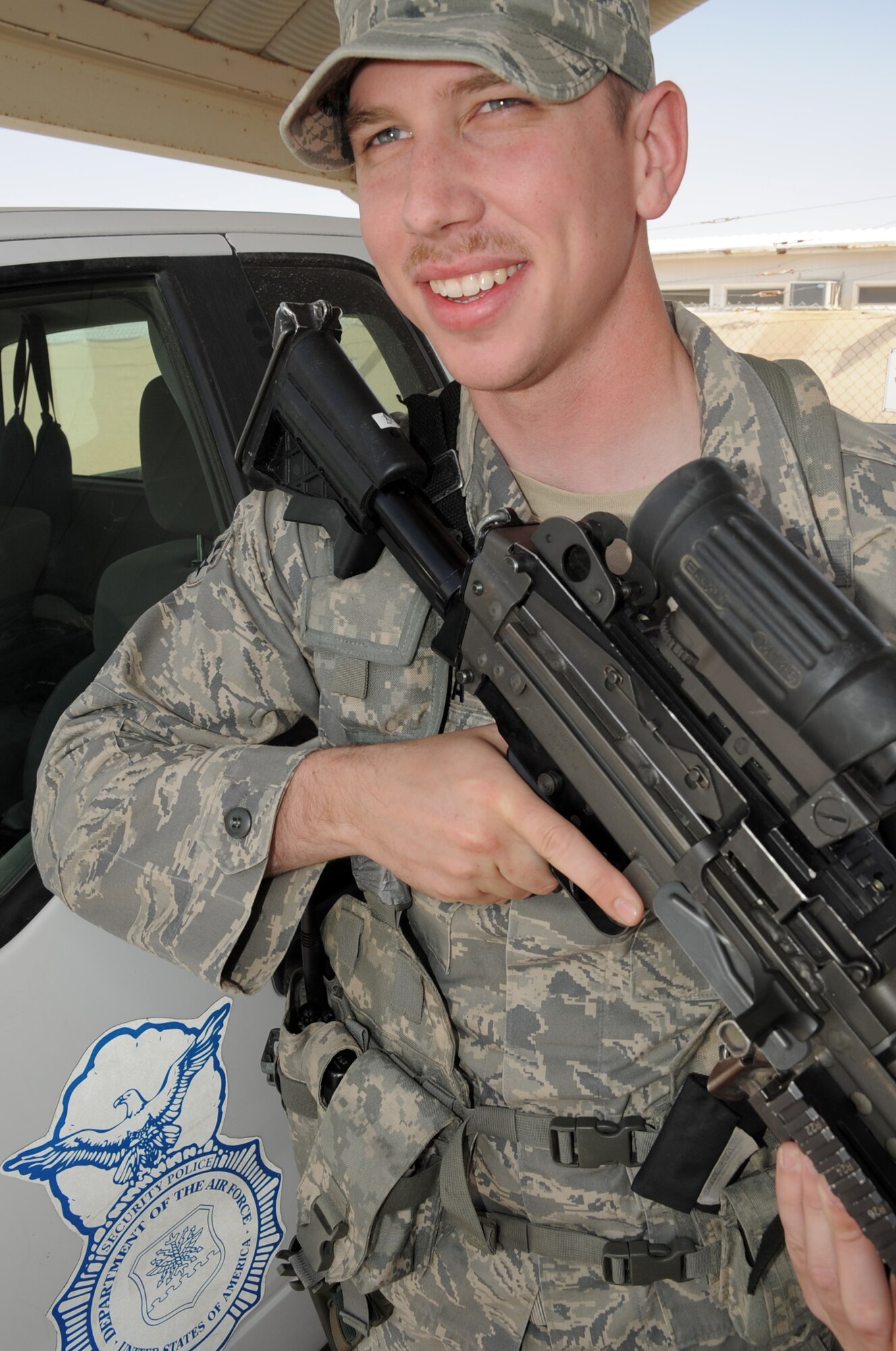Airman 1st Class Philip Basalyga, a security forces apprentice with the 380th Expeditionary Security Forces Squadron, carries equipment to a vehicle during operations at a non-disclosed base in Southwest Asia on March 19, 2010. He is deployed from the 21st Security Forces Squadron at Peterson Air Force Base, Colo., and his hometown is Columbia, Tenn. (U.S. Air Force Photo/Master Sgt. Scott T. Sturkol/Released)