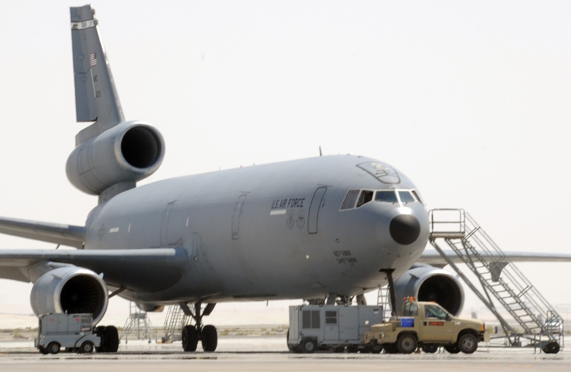 Maintenance Airmen from the 380th Expeditionary Aircraft Maintenance Squadron Extender aircraft maintenance unit work on a KC-10 Extender during operations on the flightline at a non-disclosed base in Southwest Asia on March 18, 2010.  The KC-10 is assigned to the 908th Expeditionary Air Refueling Squadron of the 380th Air Expeditionary Wing. The 908th EARS and the 380th AEW support operations Iraqi Freedom and Enduring Freedom and the Combined Joint Task Force-Horn of Africa. (U.S. Air Force Photo/Master Sgt. Scott T. Sturkol/Released)