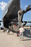 Joint Task Force-Bravo members load a C-17 Globemaster III March 20 with the first of three UH-60 Blackhawks that were loaded in a single aircraft before deploying March 21 from Soto Cano Air Base, Honduras to  Port au Prince, Haiti. Team Soto Cano sent more than 180,000 pounds of equipment and 40 personnel to support Joint Task Force-Haiti's disaster relief mission, Operation Unified Response. (U.S. Air Force photo/Staff Sgt. Bryan Franks) 