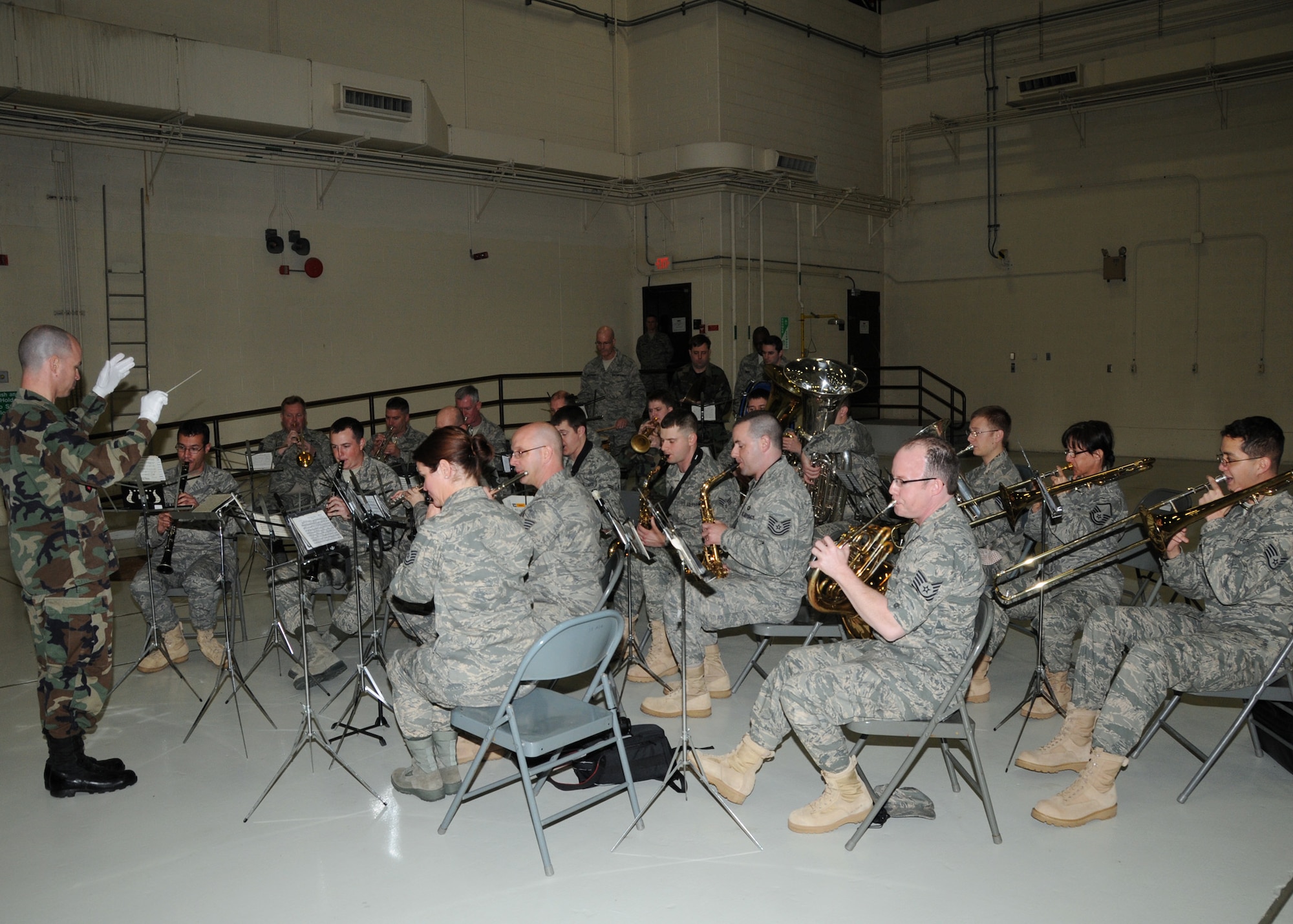 The 571st AF Band of the Central States plays during Col Gregory Champagne's assumption of command ceremony at Whiteman AFB, March 20.  The 571st, located at Lambert ANGB, is directed by Capt. John Arrata.   (U.S. Air Force photo by Master Sgt. Mary-Dale Amison  RELEASED)