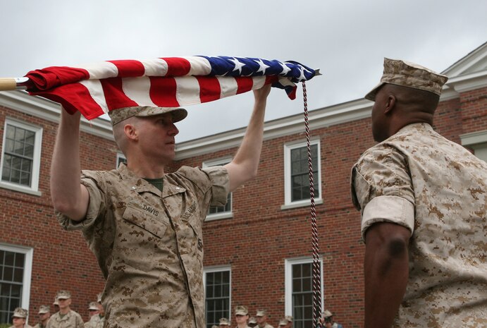 Lt. Col. Eric Davis (left), the commanding officer of Combat Logistics Battalion 46, 2nd Marine Logistics Group, and Sgt. Maj. Derrick Smith (right), the CLB-46 sergeant major, case their unit’s colors during a deactivation ceremony aboard Camp Lejeune, N.C., March 22, 2010.  The all-reserve battalion, which is made up of 900 Marines from 70 reserve sites spanning across 42 states, was activated for the first time in June 2009 to deploy in support of Operation Iraqi Freedom.