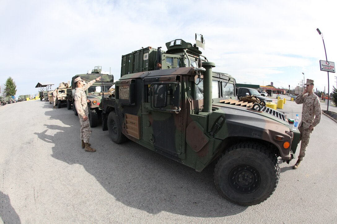 A convoy of Marines with the 26th Marine Expeditionary Unit takes a break at a truck stop in North Carolina on its way to Fort Pickett, Va. to commence initial deployment training, March 22. The Fort Pickett training will be the first exercise for the MEU in the six-month pre-deployment training period culminating in its deployment this fall.