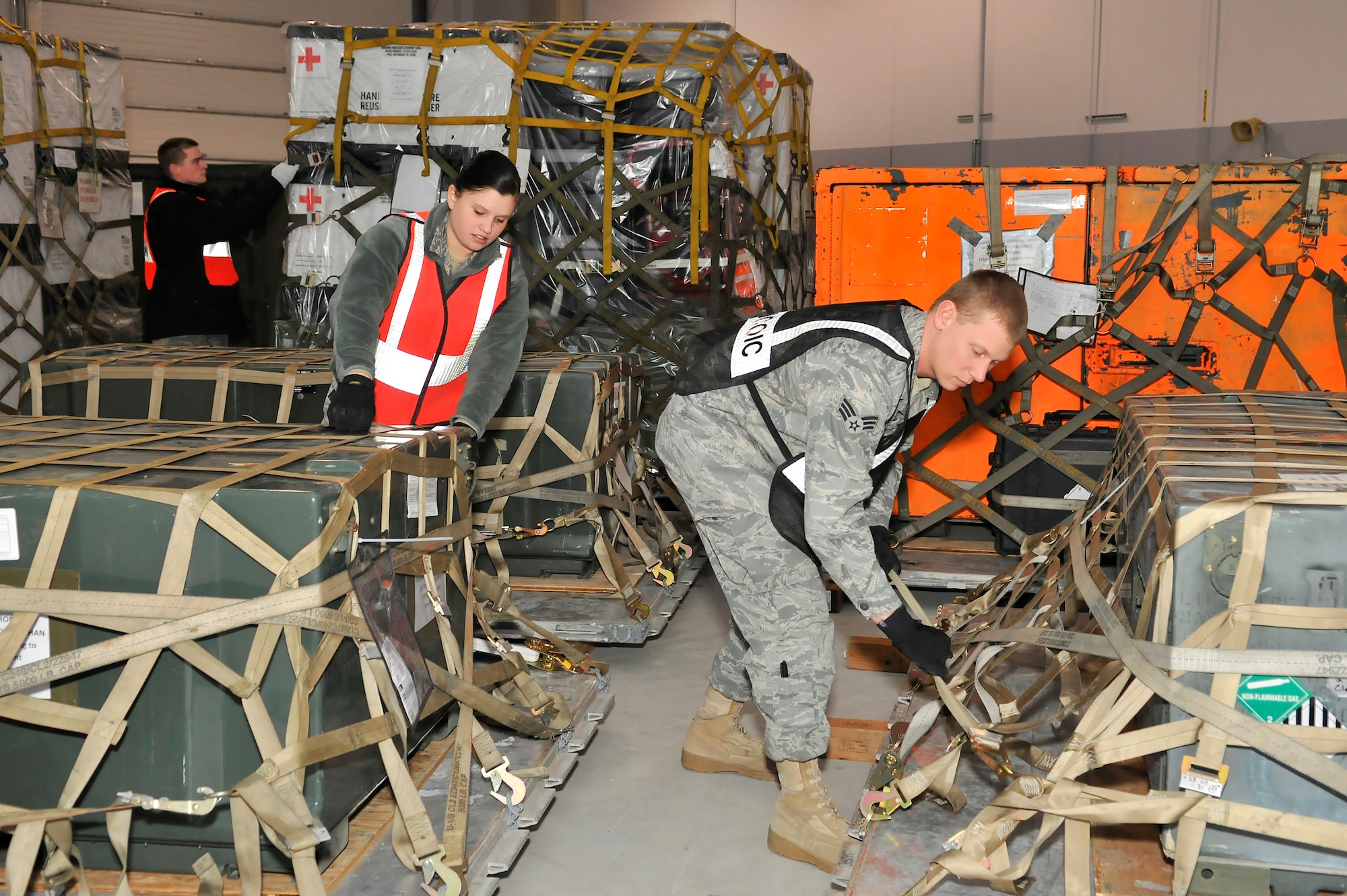 Airmen from the 354th Logistics Readiness Squadron prepare outbound cargo at the Joint Mobility Center during exercise Golden Raven 10-2 Mar. 21, 2010, Eielson Air Force Base, Alaska. (U.S. Air Force photo/Staff Sgt. Christopher Boitz/released)