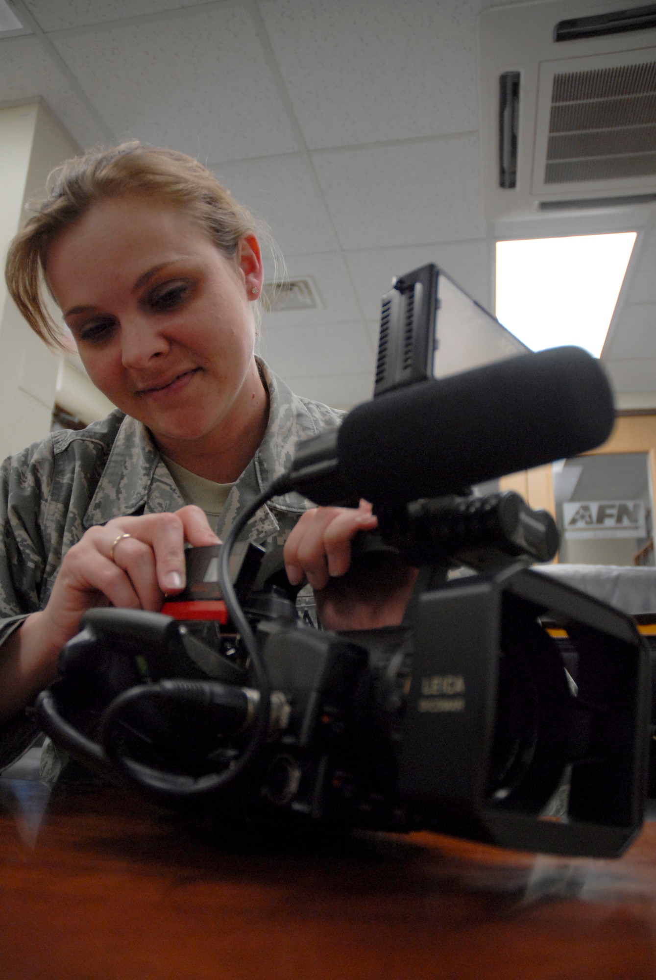 KUNSAN AIR BASE, Republic of Korea -- Tech. Sgt. Tonia Morgan, Detachment commander for American Forces Network, prepares for a video shoot by loading a tape into her camera here. AFN documents Kunsan members performing their jobs and Kunsan specific events to be broadcasted to the entire Air Force. (U.S. photo/Staff Sgt. Darnell T. Cannady)