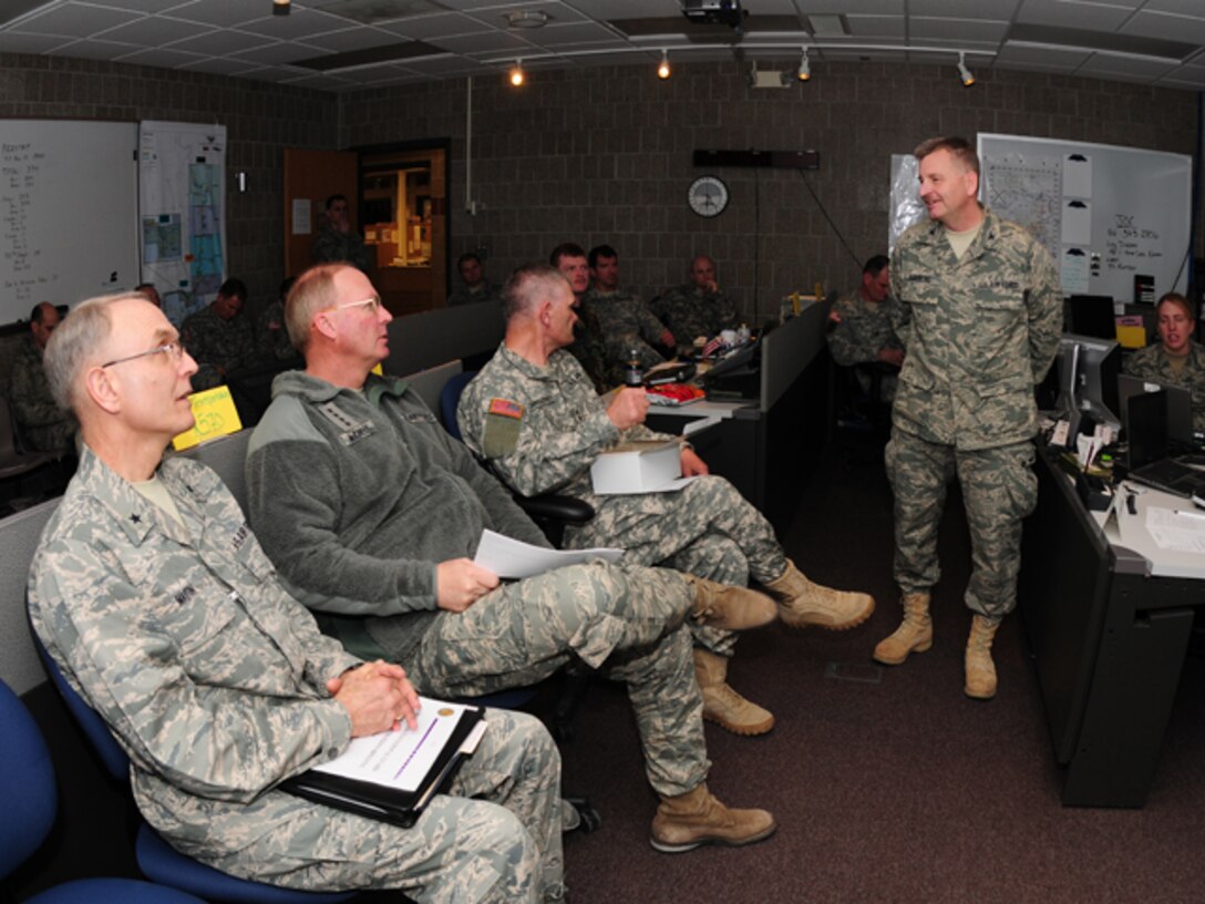 Col. Ronald Solberg, emergency operations commander for regional response platform 4 briefs Maj. Gen. David Sprynczynatyk, N.D. adjutant general, Gen. Craig R. McKinley, chief of the National Guard Bureau and Brig. Gen. Pat Martin, N.D. deputy adjutant general about the North Dakota National Guard flood operations currently taking place in the state on March 22.  The Emergency Operations Center began operations at the 119th Wing, North Dakota Air National Guard on March 15 in response to flooding in the southeastern part of the state.