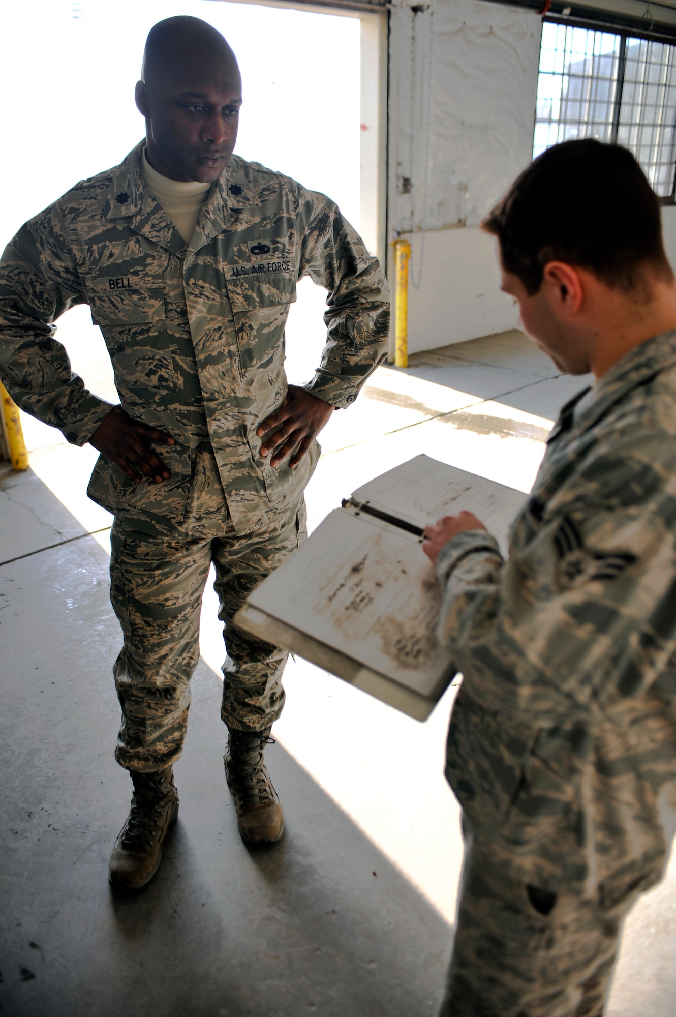 ELMENDORF AIR FORCE BASE, Alaska – Lt. Col. Kenyon Bell, 3rd Equipment Maintenance Squadron commander, listens to Senior Airmen Philip Musgrave, 3rd EMS Munitions Flight, as he gives him a safety brief before entering a missile maintenance room March 19. Colonel Bell was named the winner of the 2009 Lt. Gen. Leo Marquez Missile and Munitions Maintenance Field Grade Manager award. The colonel is expected to accept his award in Washington D.C. April 28. (Air Force photo by Airman 1st Class Christopher Gross)