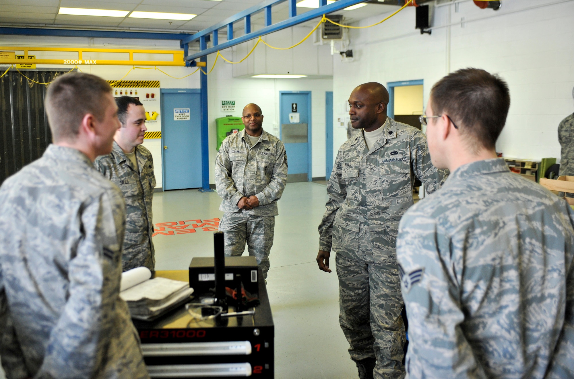 ELMENDORF AIR FORCE BASE, Alaska – Lt. Col. Kenyon Bell, 3rd Equipment Maintenance Squadron commander, casually holds a conversation with Airmen from his armament flight March 19. Colonel Bell was named the winner of the 2009 Lt. Gen. Leo Marquez Missile and Munitions Maintenance Field Grade Manager award. The colonel is expected to accept his award in Washington D.C. April 28. (Air Force photo by Airman 1st Class Christopher Gross)