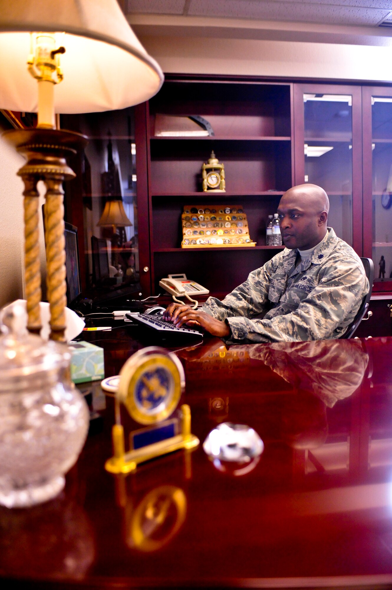 ELMENDORF AIR FORCE BASE, Alaska – Lt. Col. Kenyon Bell, 3rd Equipment Maintenance Squadron commander, works behind his desk March 19. Colonel Bell was named the winner of the 2009 Lt. Gen. Leo Marquez Missile and Munitions Maintenance Field Grade Manager award. The colonel is expected to accept his award in Washington D.C. April 28. (Air Force photo by Airman 1st Class Christopher Gross)