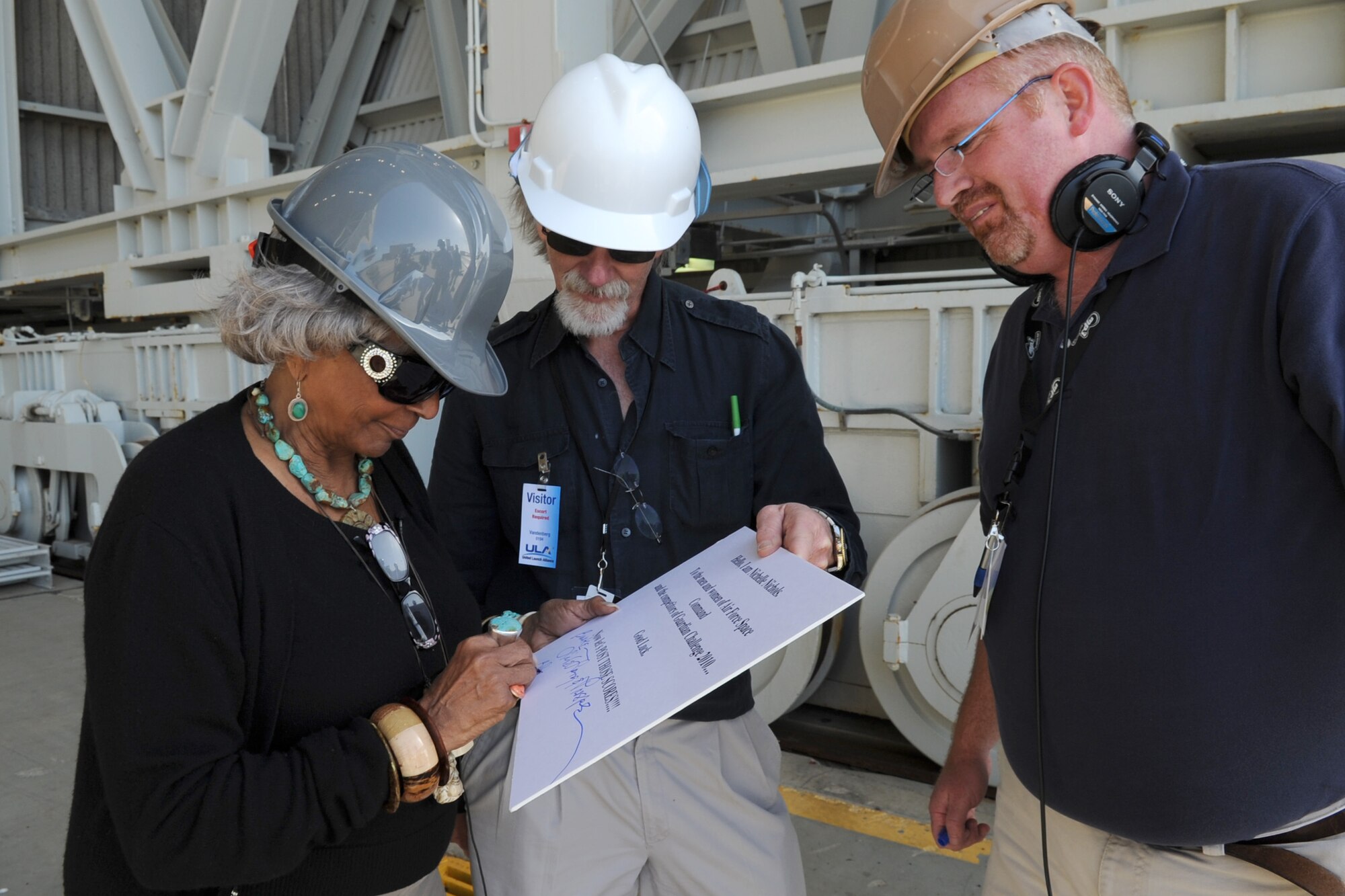 VANDENBERG AIR FORCE BASE, Calif. -- Nichelle Nichols, a cast member from the original "Star Trek" series, autographs a cue card used for her slug line during an interview here Friday, March 19, 2010. (U.S. Air Force photo/Senior Airman Bryan Boyette)