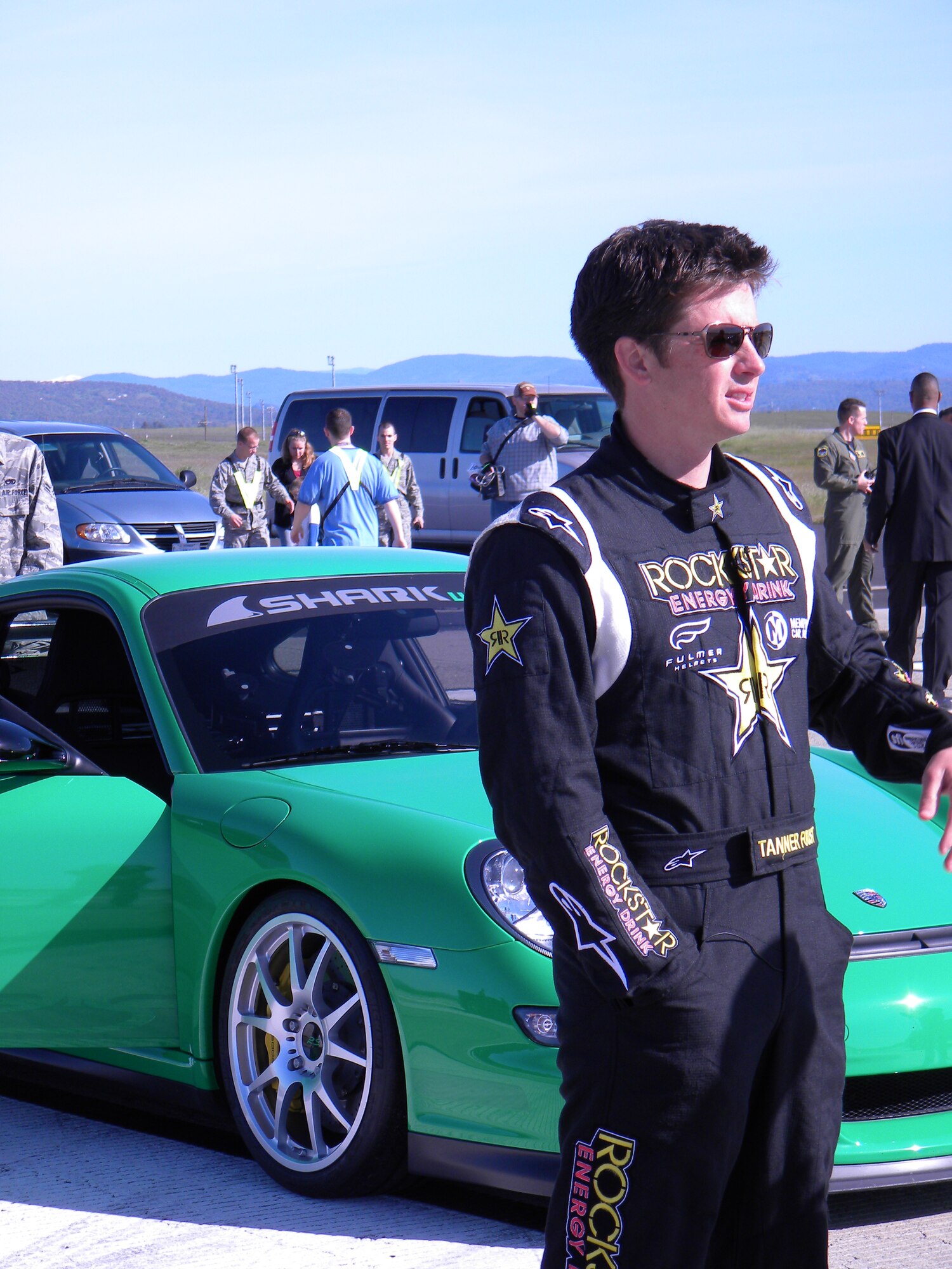 Tanner Faust evaluates runway conditions before the race.  Faust, a professional driver and TV personality, exceeded speeds of 200 miles per hour in a Porsche 997 GT3RS dubbed 'Kermit," competing in a challenge of speed and endurance at Beale Air Force Base, Calif., March 14, during a taping of Speed Channel's Battle of the Supercars. (U.S. Air Force Photo/Dana Lineback)