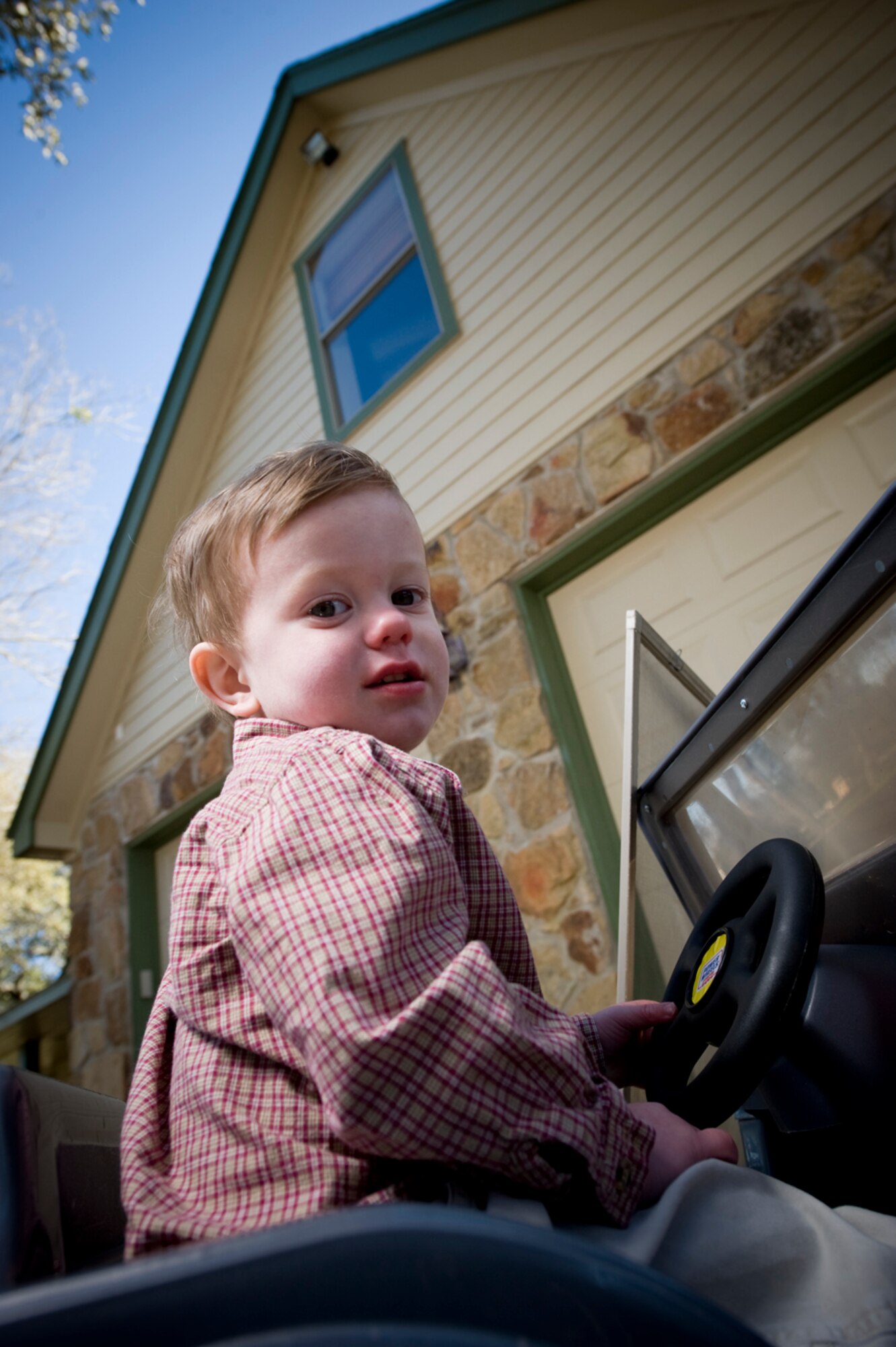 Cannon, who loves airplanes, took his first "flight" when he pushed the screen out of the second-story window and both he and the screen went airborne.
(Photo by TSgt Samuel Bendet)

