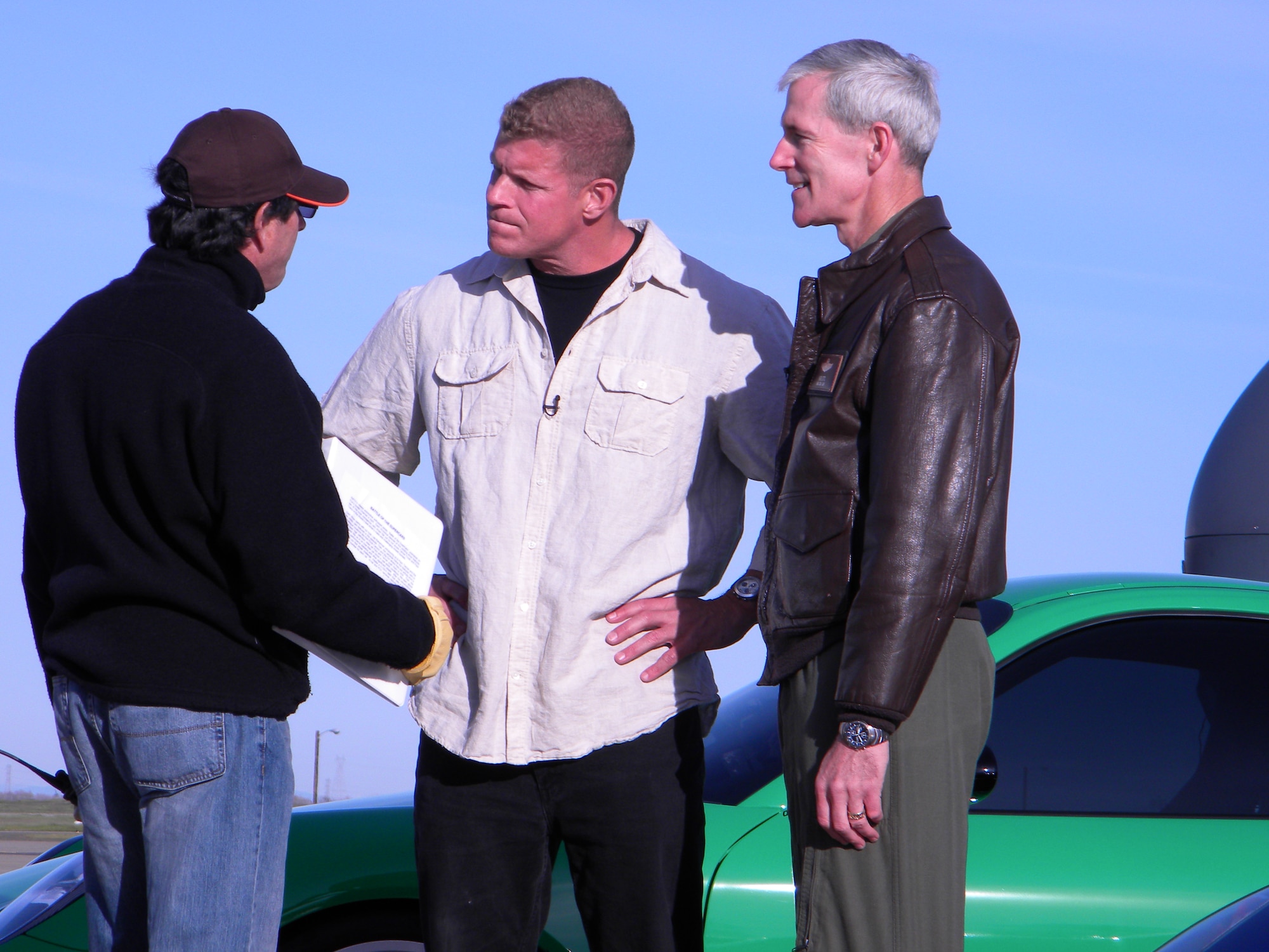 Lee Reherman, host of SPEED Channel's Battle of the Supercars, gets last-minute direction from his producer before interviewing Brig. Gen. Robert Otto, 9th Reconnaissance Wing Commander.  Speed Channel crews visited Beale Air Force Base, Calif., March 13 and14 to film an episode set to air sometime in June. (U.S. Air Force Photo/Dana Lineback) 