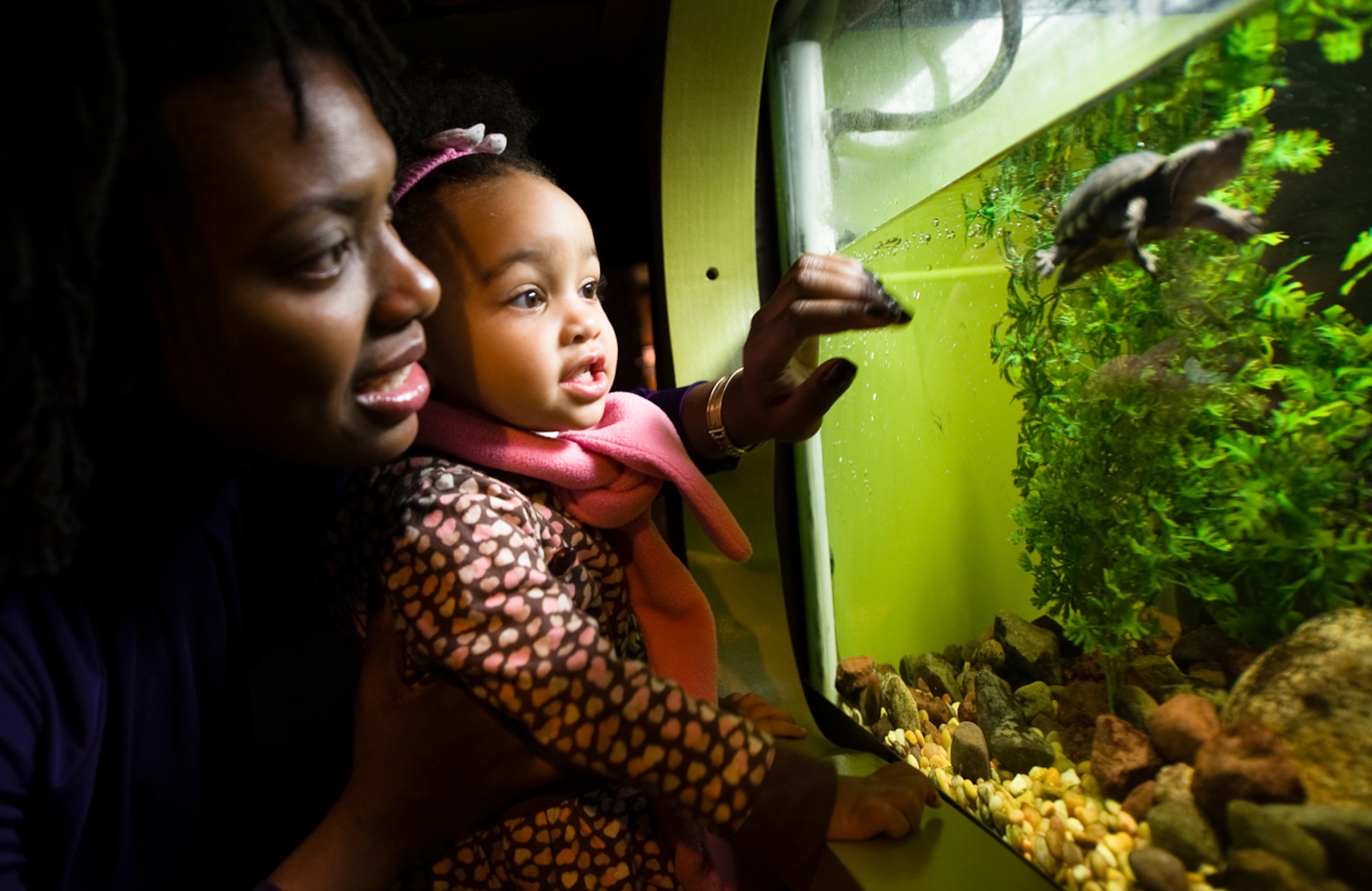 With her daughter, who will be 2 in May, Munro-Harris said her brush with death made her focus on what's really important in life...family. (Photo by TSgt Samuel Bendet)