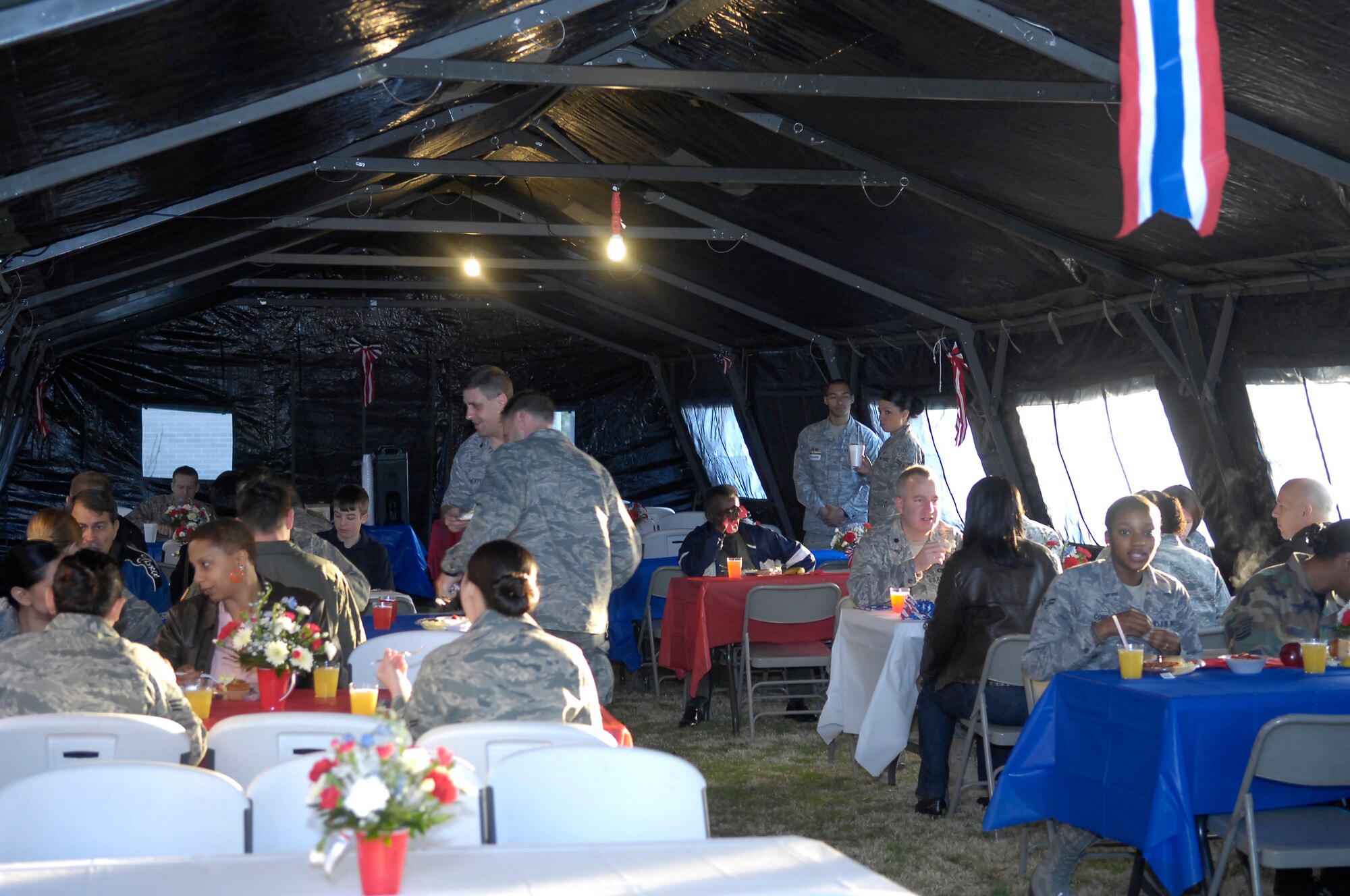 Pope Airmen gather in the early morning at the Pope Chapel to enjoy the National Prayer Breakfast March 19. Airmen listened to guest speaker, Chaplain (Col.) Conrado Navarro, Air Mobility Command Chaplain and musical guest, Pastor Marvin Gregory. (U.S. Air Force Photo by Senior Airman Kris Levasseur) 