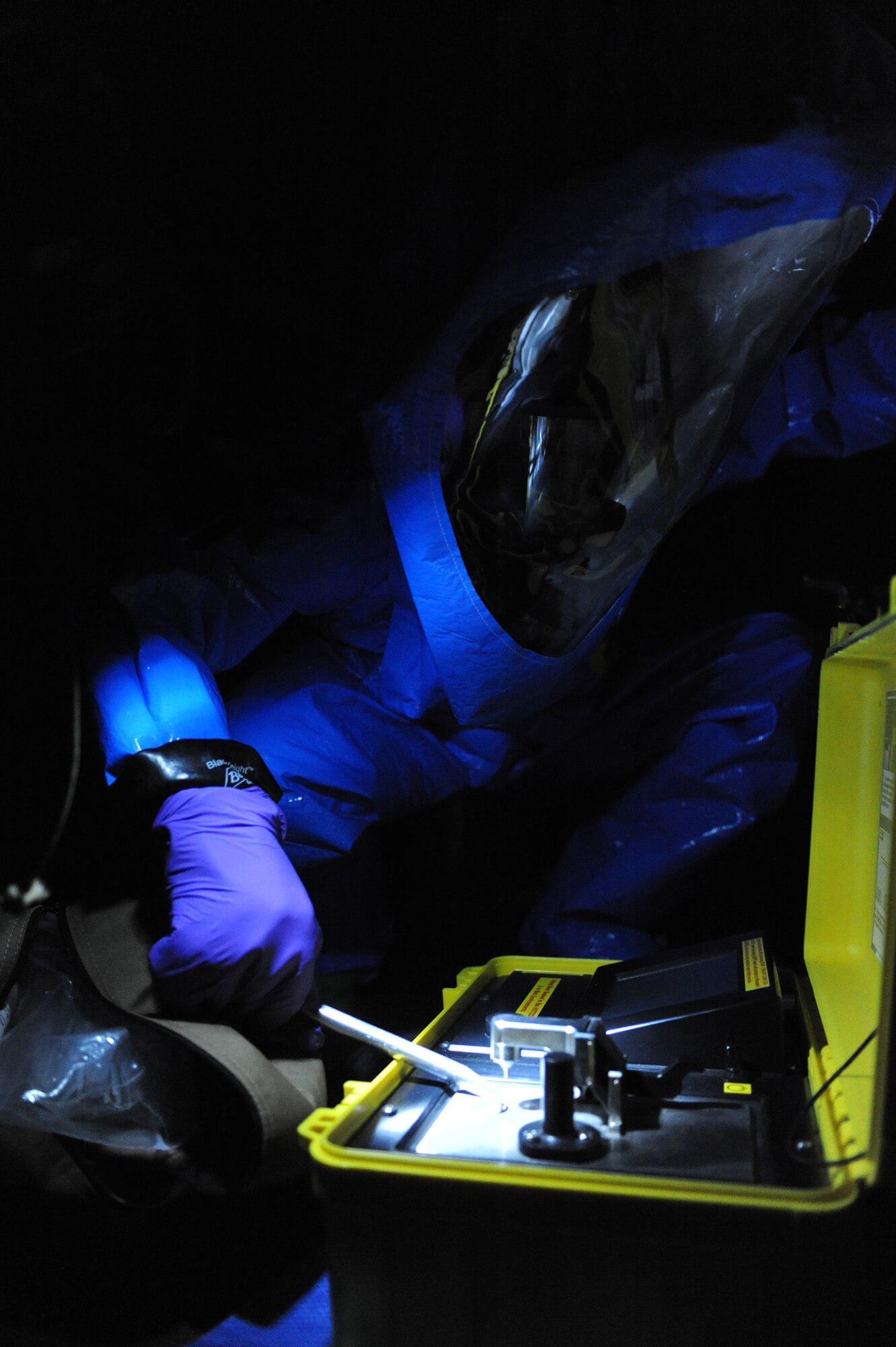WHITEMAN AIR FORCE BASE, Mo. --  Senior Airman Hellen Cremer, 509th Medical Operations Squadron Bio-environmental Engineer, samples a simulated suspicious powder found during the CBRN Challenge here, March 16, 2010.  In the exercise, Whiteman members performed their jobs during simulated catastrophes, showcasing their ability to deal with disaster. (U.S. Air Force photo by Airman 1st Class Carlin Leslie) (Released)




