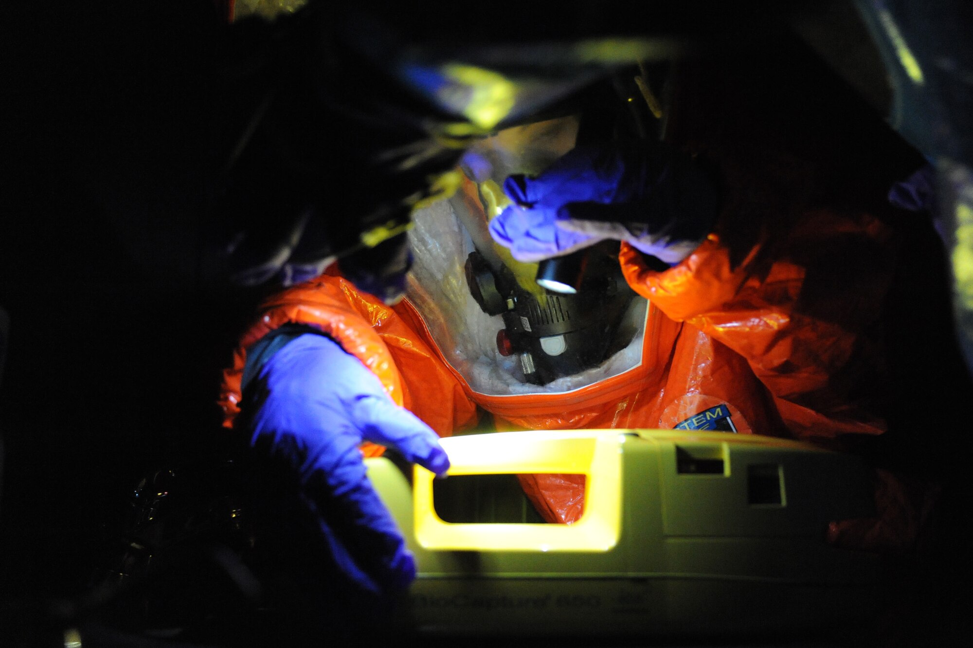 Staff Sgt. Brandi Baker, 509th Civil Engineer Squadron, NCO in charge of Plans and Operations Readiness and Emergency Management Flight, prepares the Bio Capture machine during a biological chemical exercise, here, March 16,  2010. The machine cycles air through its vents and collects air samples for lab technicians to test for airborne chemicals. (U.S. Air Force photo by Airman 1st Class Carlin Leslie) (Released)



