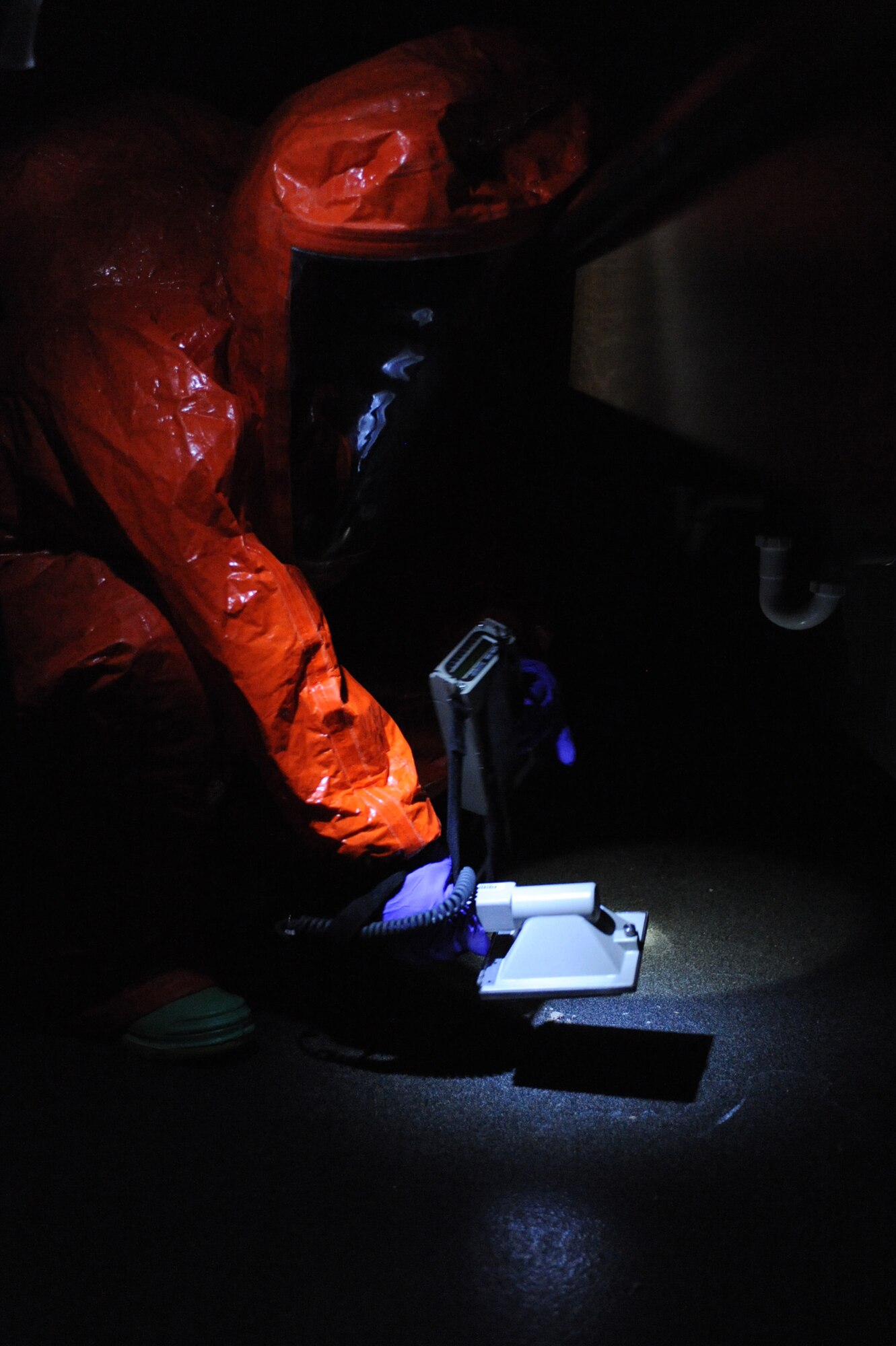 WHITEMAN AIR FORCE BASE, Mo. -Staff Sergeant Brandi Baker, 509th Civil Engineering Squadron, NCO In Charge, Plans and Operations Readiness and Emergency Management Flight, prepares the Bio Capture machine during a biological chemical exercise, here, March 16, 2010. The Bio Capture cycles air through its vents and collects air samples so lab technicians can test for any airborne chemicals. (U.S. Air Force photo by Airman 1st Class Carlin Leslie) (Released)

