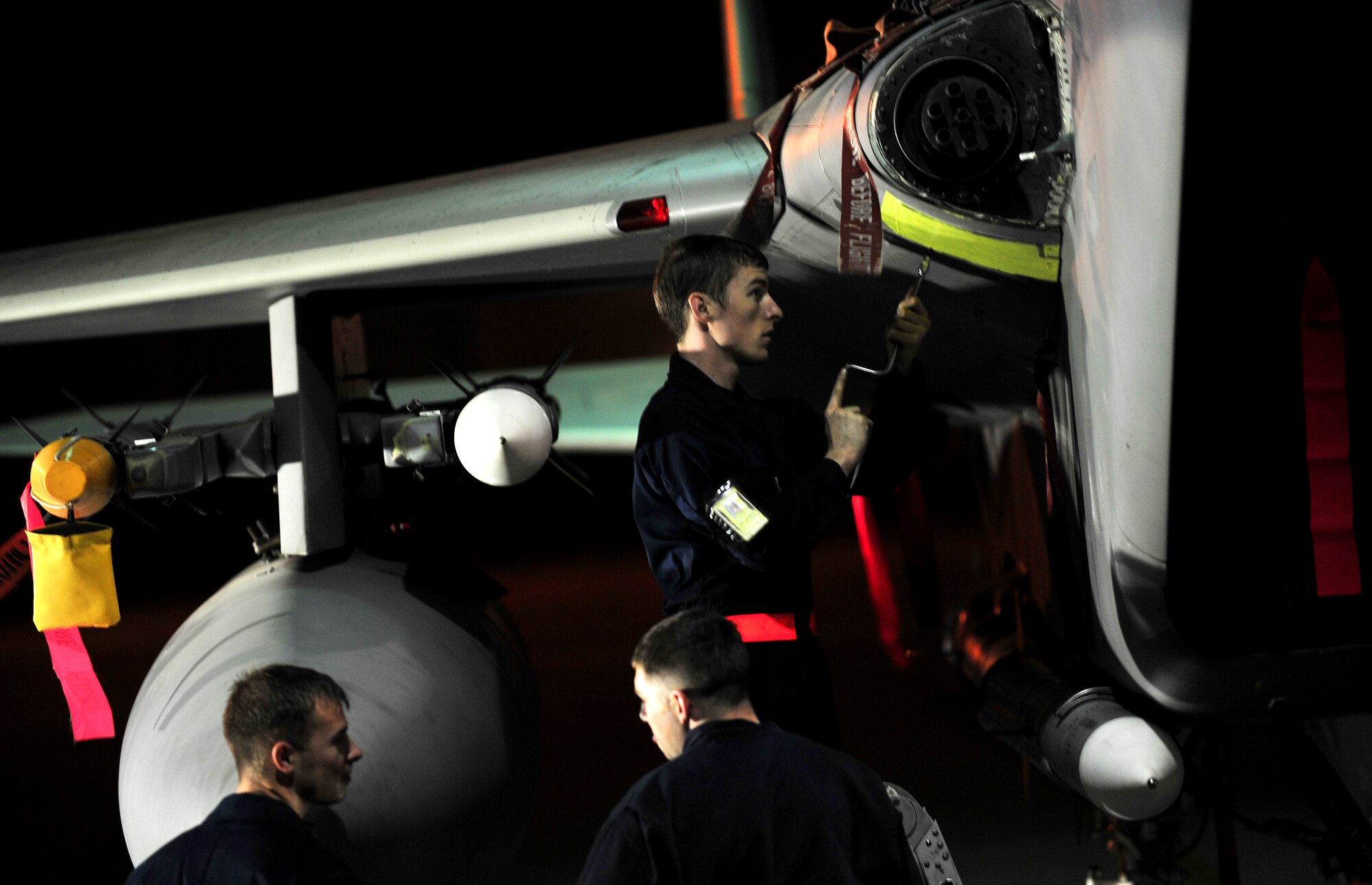 Airman 1st Class Jordan Musel, 18th Aircraft Maintenance Squadron crew chief, repaired and reinstalled a gun bay panel during Beverly High 10-02 at Kadena Air Base, Japan, March 22.  The 18th Wing is participating in a Local Operational Readiness Exercise March 22-26 to test the readiness of Kadena Airmen. (U.S. Air Force photo/Tech. Sgt. Rey Ramon)   