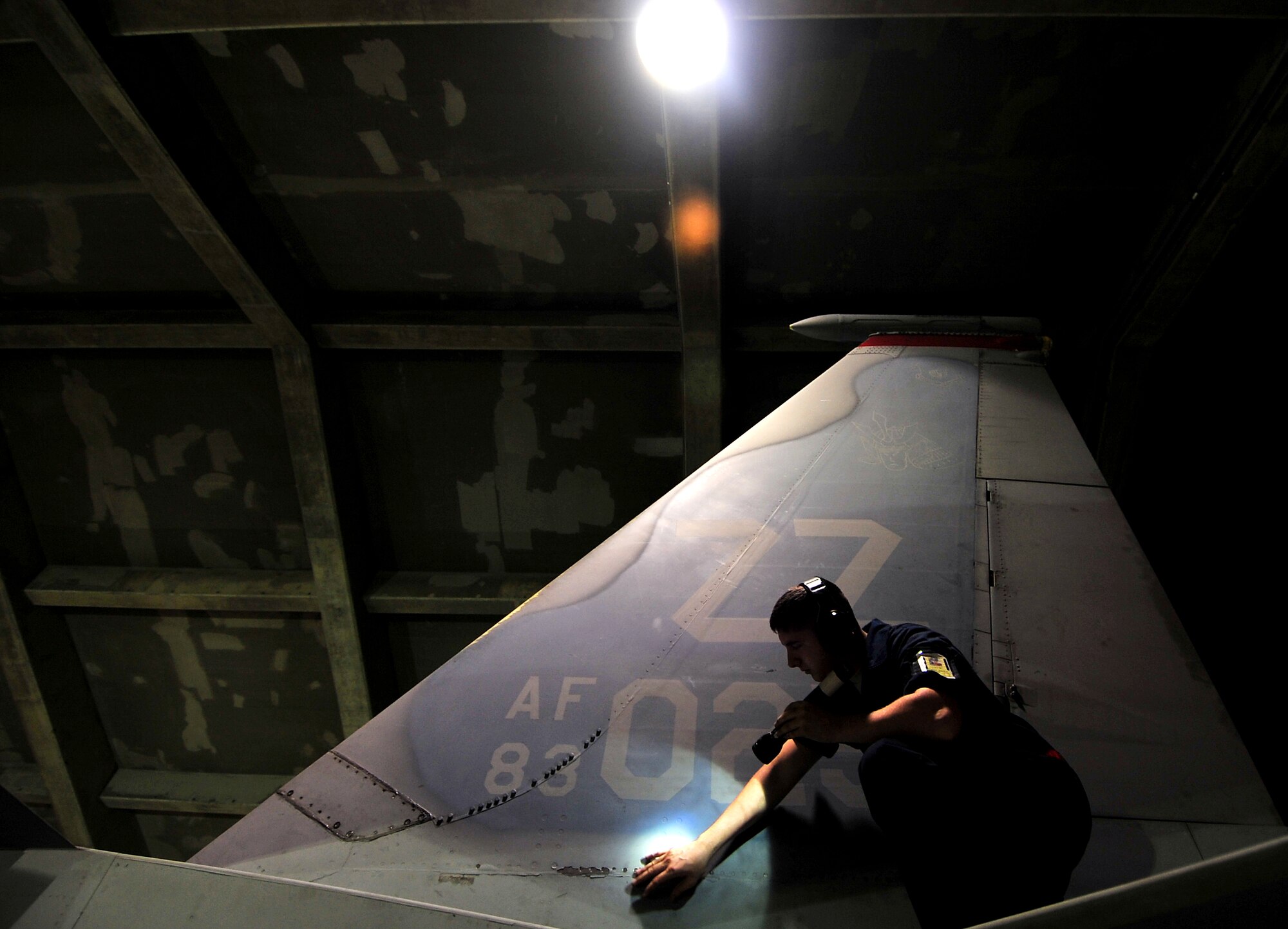 Airman 1st Class David Eckert, 18th Aircraft Maintenance Squadron technical aviation mechanic, conducts his pre-flight checks on an F-15C Eagle during Beverly High 10-02 at Kadena Air Base, Japan, March 23.  The 18th Wing is participating in a Local Operational Readiness Exercise March 22-26 to test the readiness of Kadena Airmen. (U.S. Air Force photo/Tech. Sgt. Rey Ramon)  