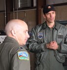 Slovenian air force Capt. Nikolaj Galesa (right) listens on as members of his military delegation ask questions to Lt. Col. David Condit (left) March 18 about the Air Force Reserve's aerial firefighting capability, based at Peterson Air Force Base, Colo. Captain Galesa, together with three other members from Slovenia, were sponsored by the Colorado Air National Guard for their visit to the U.S. and to 302nd Airlift Wing at Peterson AFB. The Slovenian airmen also learned about C-130 Hercules operations and the challenges with using the aircraft with Modular Airborne Firefighting Systems, or 'MAFFS.' Colonel Condit is the 302nd AW's chief of safety as well as the Air Force Reserve Command's aerial firefighting coordinator. (U.S. Air Force photo/Staff Sgt. Stephen J. Collier)